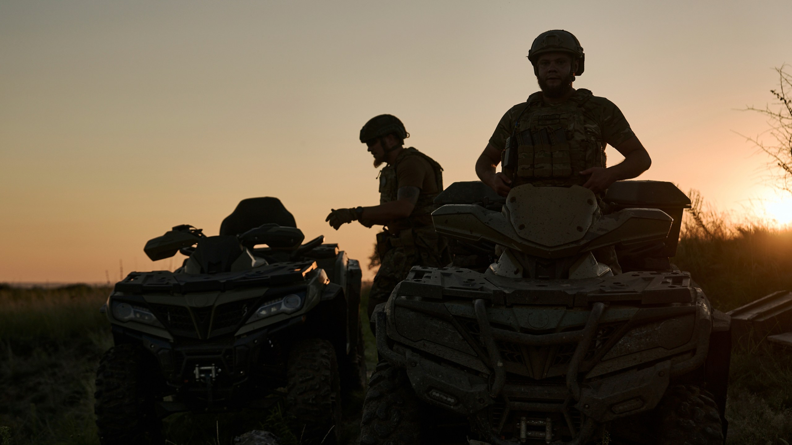 Ukrainian soldiers ride all-terrain vehicles at the front line near Bakhmut, one of the longest battles with Russian troops, Ukraine, Monday, Aug. 14, 2023. (AP Photo/Libkos)