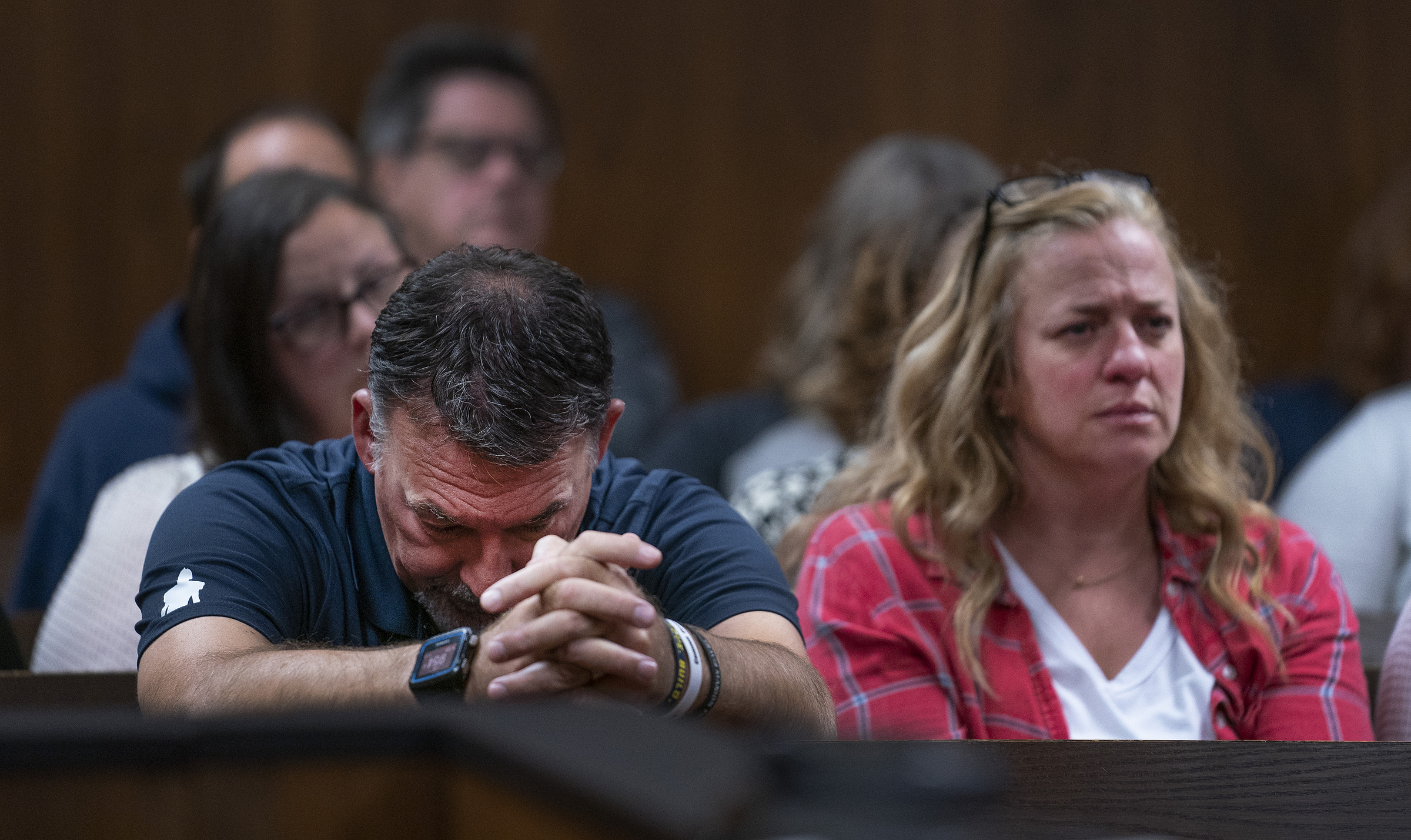 Buck Myre, left, and Sheri Myre parents of slain son Tate Myre, listen to testimony as their son's killer, Ethan Crumbley appears in the Oakland County courtroom of Kwame Rowe, on Friday, Aug. 18, 2023, in Pontiac, Mich. The judge will hear a fourth and final day of testimony Friday to determine whether Crumbley will get a life sentence for the fatal shooting of four students at a Michigan school in 2021. (Mandi Wright/Detroit Free Press via AP, Pool)