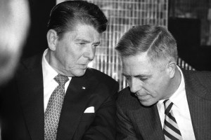 FILE - Republican presidential candidate Ronald Reagan, left, and former New York Sen. James Buckley chat at a fundraising cocktail party sponsored by the friends of the conservative party, in New York, Jan. 15, 1980. Buckley, an early agitator for Richard Nixon's resignation and winner of a landmark lawsuit challenging campaign spending limits, died Friday, Aug. 18, 2023, at age 100. (AP Photo/Carlos Rene Perez, File)