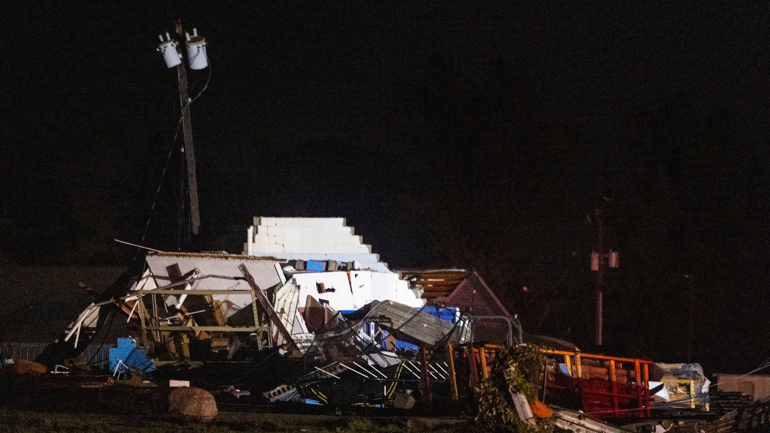 Damage to a structure is left after a strong storm passed in Kent County, Michigan on Thursday, Aug. 24, 2023. A strong storm powered by winds up to 75 mph has downed trees and power lines across Michigan, torn roofs off buildings and left hundreds of thousands of customers without power. (Joel Bissell/Kalamazoo Gazette via AP)