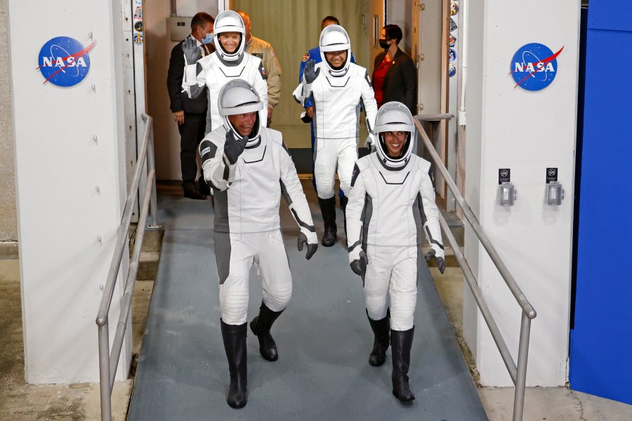 Danish astronaut Andreas Mogensen, front left, NASA astronaut Jasmin Moghbeli, front right, Russian cosmonaut Konstantin Borisov, back left, and Japanese astronaut Satoshi Furukawa leave the Operations and Checkout Building before heading to the launch pad to board the SpaceX Falcon 9 rocket on a mission to the International Space Station, at Kennedy Space Center in Cape Canaveral, Fla., early Saturday, Aug. 26, 2023. (AP Photo/Terry Renna)