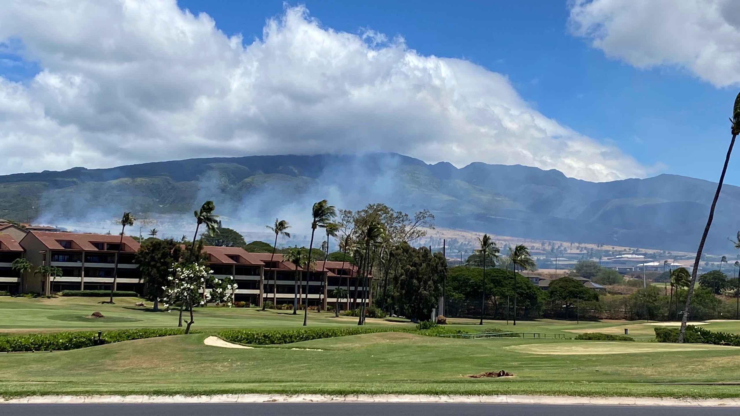 Smoke rises in the hills above the Kaanapali resort hotel area of Lahaina, Hawaii on Saturday, August 26, 2023. A brush fire on Saturday prompted Maui authorities to evacuate residents from a neighborhood of Lahaina, just a few miles from the site recently ravaged by blazes. (Cindy Ellen Russell/Honolulu Star-Advertiser via AP)