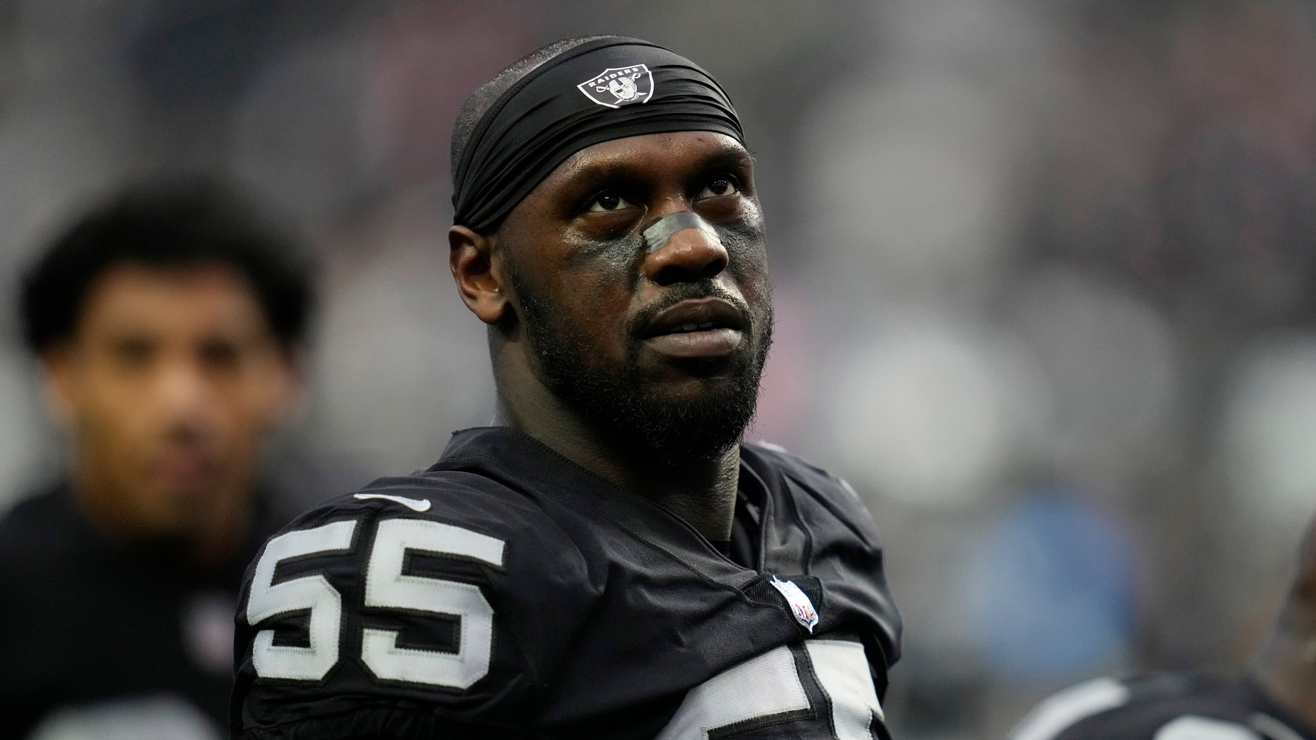 FILE - Las Vegas Raiders defensive end Chandler Jones (55) warms up before an NFL football game against the New England Patriots, Monday, Dec. 19, 2022, in Las Vegas. Las Vegas Raiders defensive end Chandler Jones indicated in since-deleted social media posts on Tuesday, Sept. 5, 2023, that he no longer wanted to play for coach Josh McDaniels and general manager David Ziegler.(AP Photo/John Locher, File)