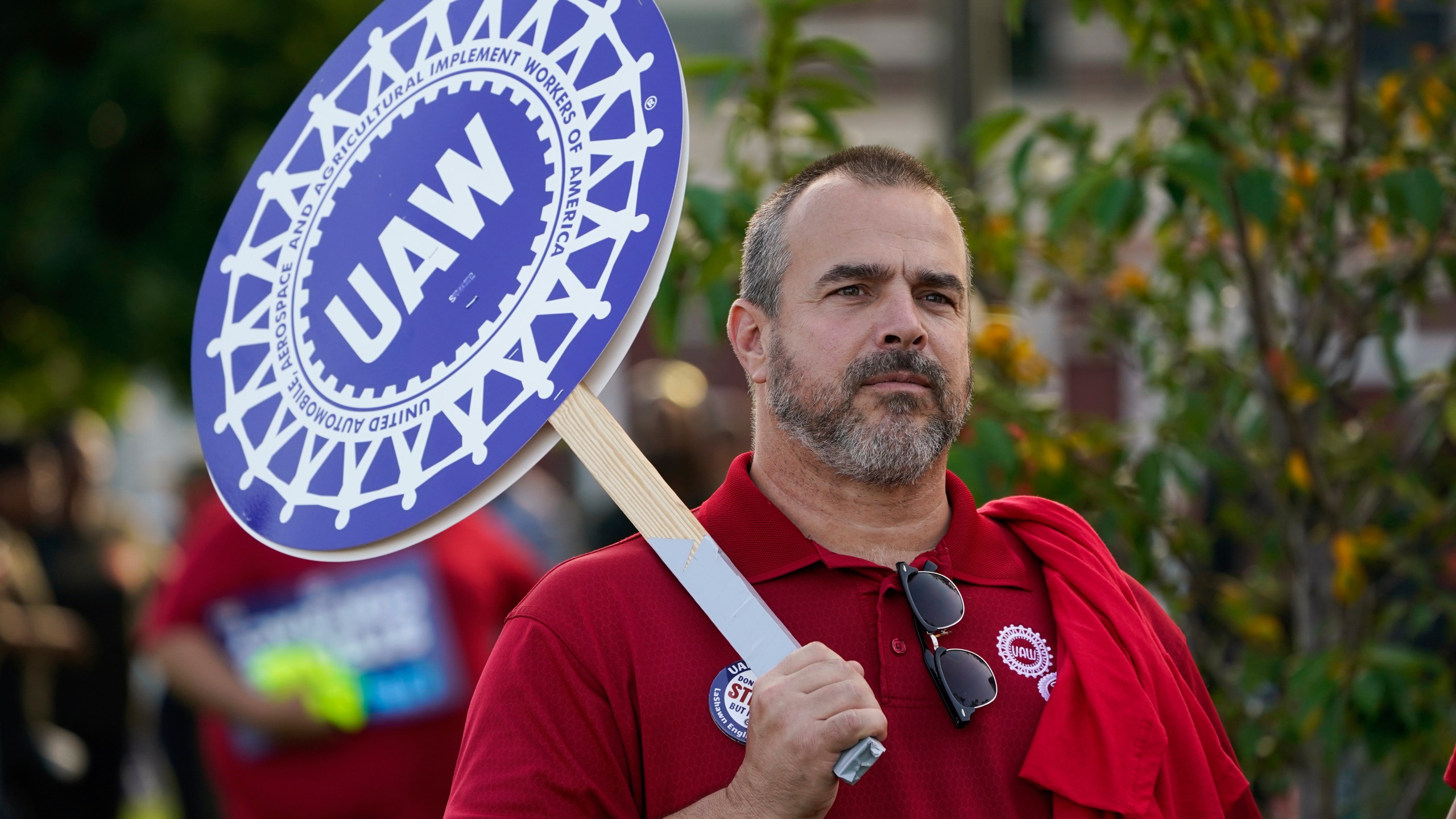 United Auto Workers member John Weyer walks in the Labor Day parade in Detroit, Monday, Sept. 4, 2023. (AP Photo/Paul Sancya)