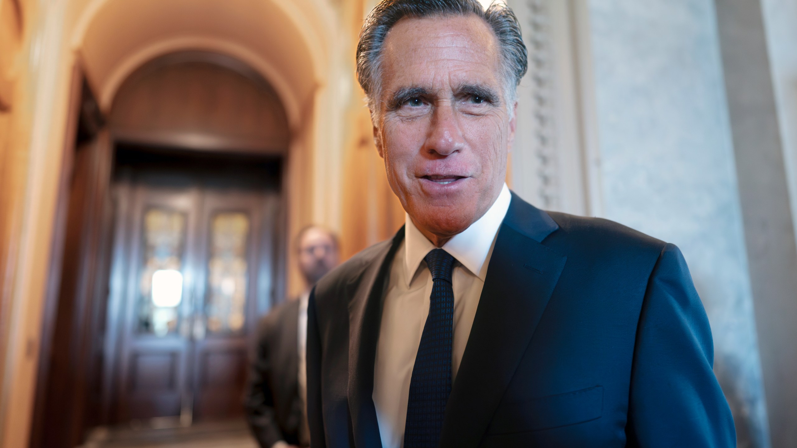 FILE - Sen. Mitt Romney, R-Utah, and other senators arrive at the chamber for votes, at the Capitol in Washington, Wednesday, Sept. 6, 2023. Romney will not run for reelection in 2024. The former presidential candidate and Massachusetts governor announced his intentions in a video statement Wednesday. (AP Photo/J. Scott Applewhite, File)