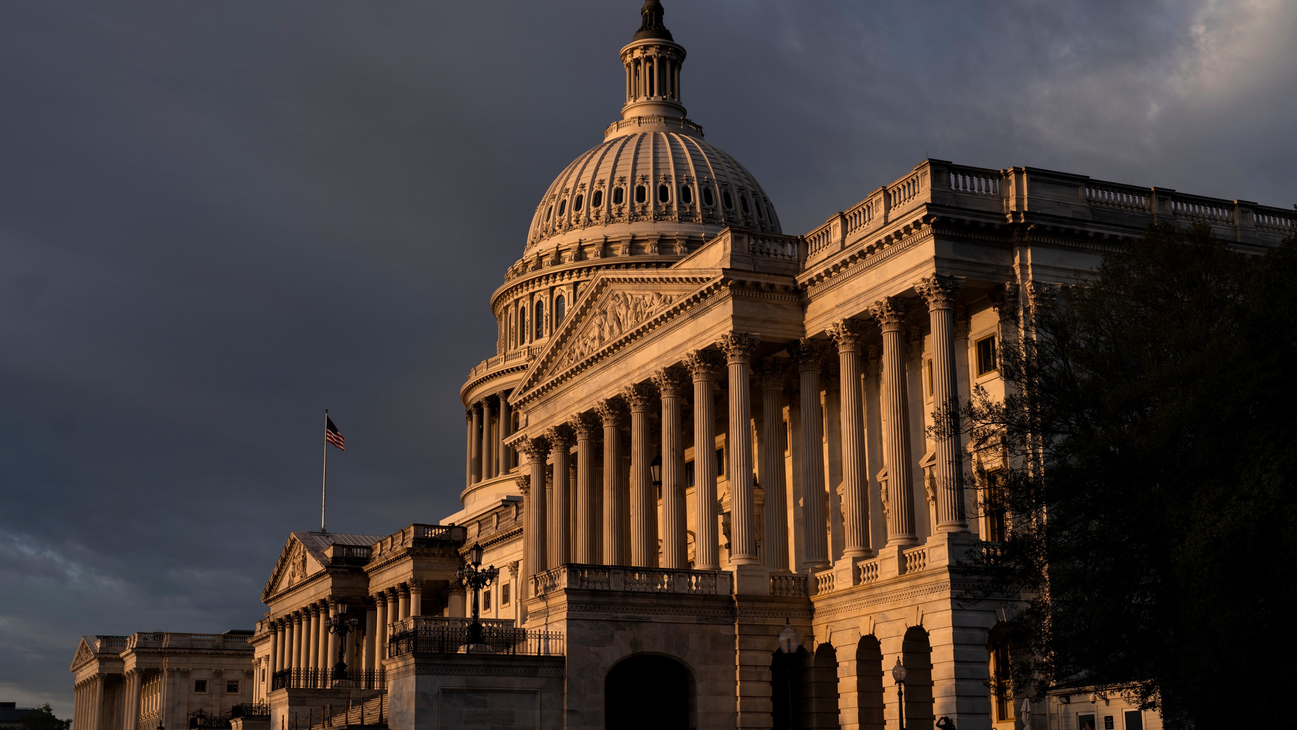 FILE - The Capitol in Washington, is seen at sunrise, Wednesday, Sept. 13, 2023. On one side of the U.S. Capitol, two senators have steered the debate over government funding mostly clear of partisan fights, clearing a path for bills to pass with bipartisan momentum. Steps away, on the House side of the building, things couldn’t be more different. House Republicans, trying to win support from the far-right wing of the party, have loaded up their government funding packages with funding cuts and conservative policy priorities. Democrats have responded with ire, branding their GOP counterparts as extreme and bigoted and withdrawing support for the legislation.(AP Photo/J. Scott Applewhite, File)