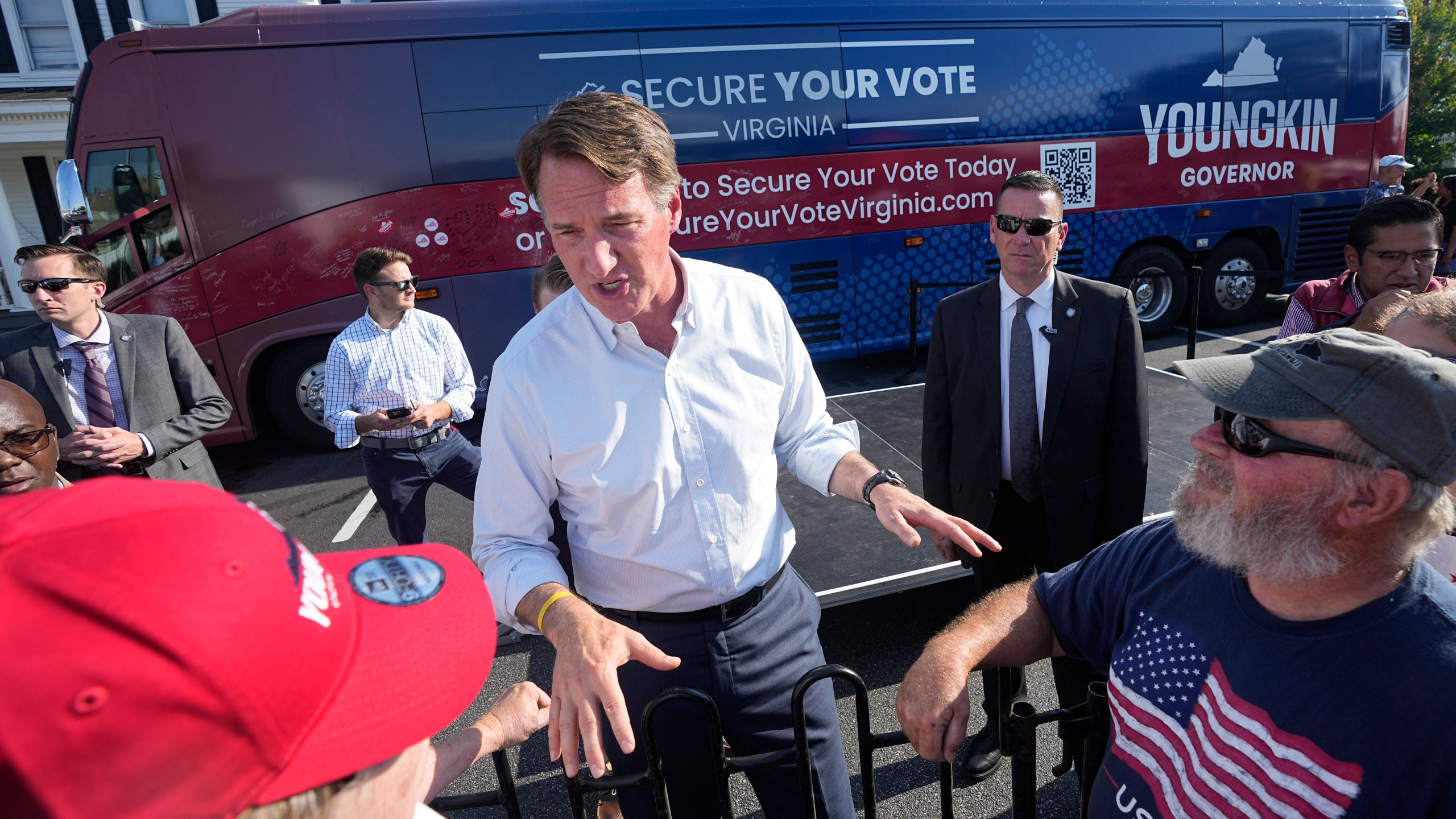 Virginia Gov. Glenn Youngkin gestures as he talks to supporters during an early voting rally Thursday Sep. 21, 2023, in Petersburg, Va. Every Virginia legislative seat will be on the ballot in the November election, and both parties see a possible path to a majority. (AP Photo/Steve Helber)