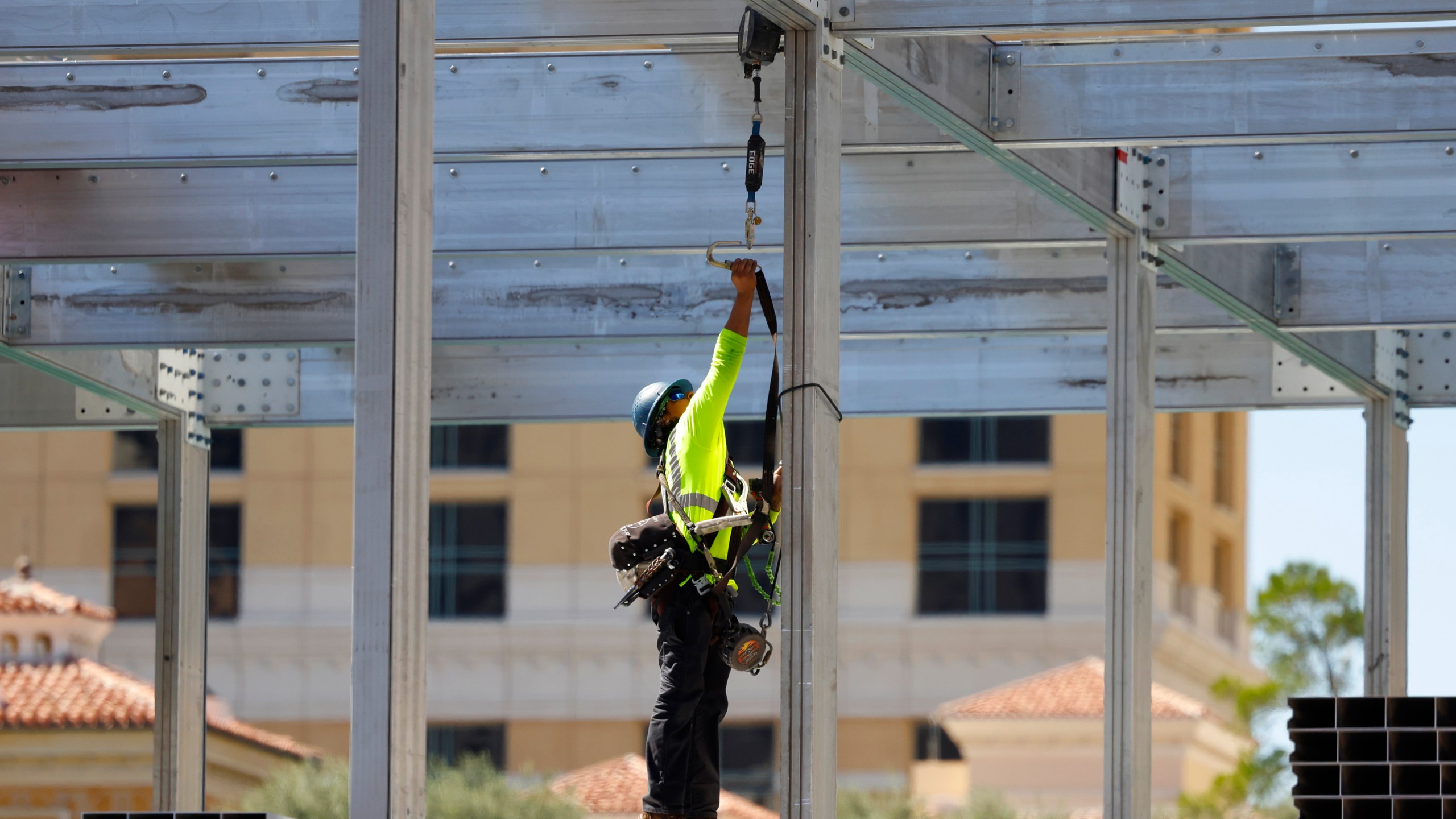 A worker is seen at a Formula One construction site at the Bellagio fountains on Monday, Sept. 25, 2023, in Las Vegas. A worker who died during the weekend of an injury received at a temporary Formula One Las Vegas Grand Prix grandstand construction site at the Bellagio resort fountains was identified Monday by authorities. (Bizuayehu Tesfaye/Las Vegas Review-Journal via AP)