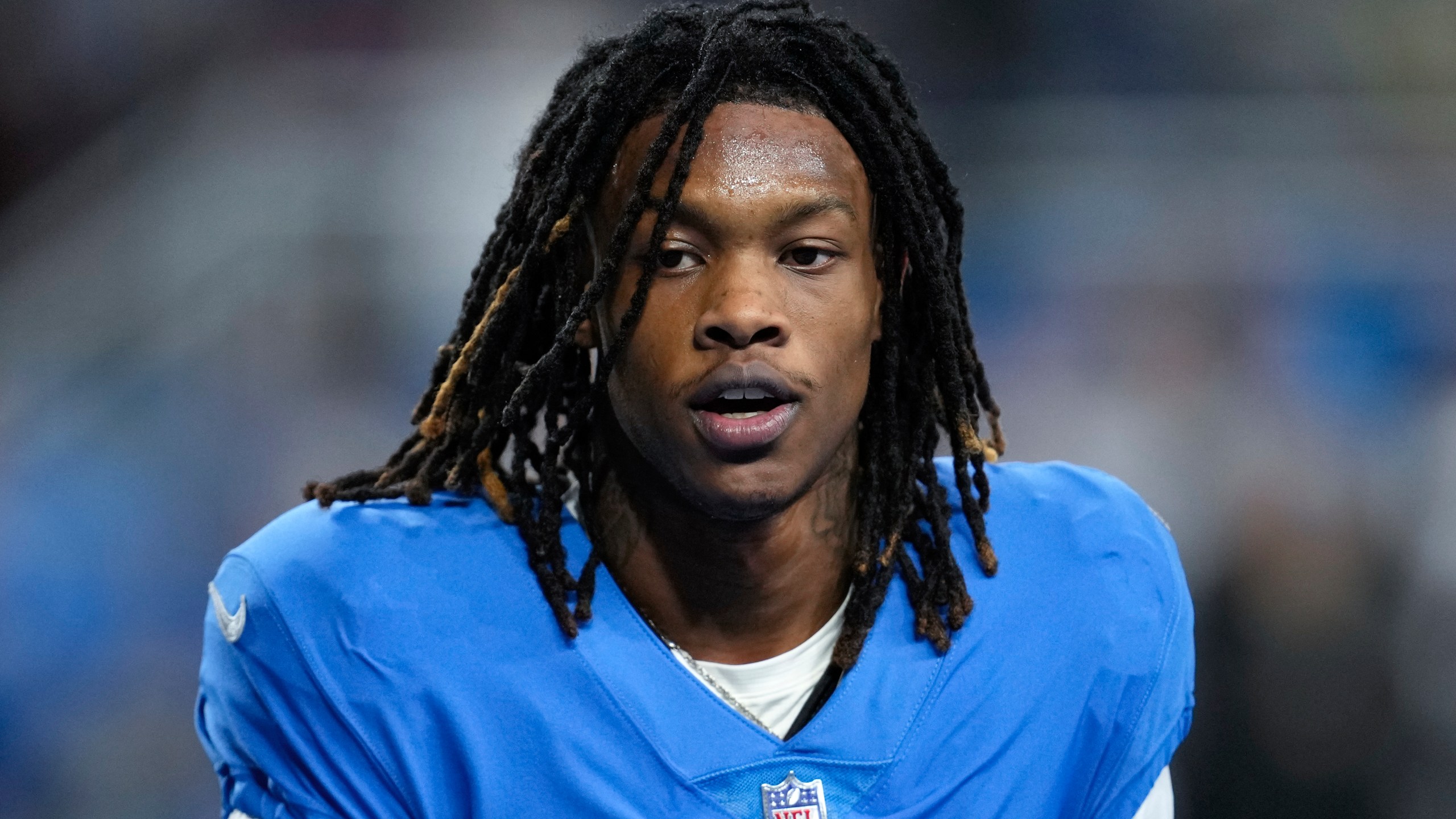 FILE - Detroit Lions wide receiver Jameson Williams watches during an NFL football game against the Chicago Bears in Detroit, Jan. 1, 2023. The NFL has revised its gambling policy and is reinstating three players who previously received longer suspensions. Tennessee's Nicholas Petit-Frere and Detroit's Jameson Williams can return to their teams on Monday, Oct. 2. Free agent Stanley Berryhill will be eligible to participate in all activities, including games, starting Tuesday, Oct. 3. All three players were initially suspended six games.(AP Photo/Paul Sancya, File)