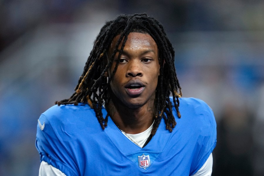 FILE - Detroit Lions wide receiver Jameson Williams watches during an NFL football game against the Chicago Bears in Detroit, Jan. 1, 2023. The NFL has revised its gambling policy and is reinstating three players who previously received longer suspensions. Tennessee's Nicholas Petit-Frere and Detroit's Jameson Williams can return to their teams on Monday, Oct. 2. Free agent Stanley Berryhill will be eligible to participate in all activities, including games, starting Tuesday, Oct. 3. All three players were initially suspended six games.(AP Photo/Paul Sancya, File)