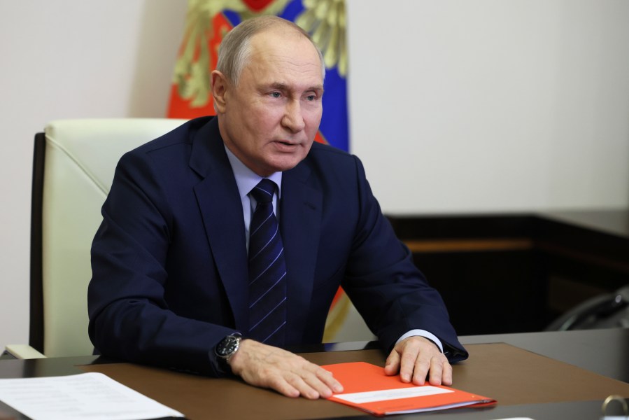 Russian President Vladimir Putin chairs a meeting with members of the Security Council via videoconference at the Novo-Ogaryovo state residence, outside Moscow, Russia, Tuesday, Oct. 3, 2023. (Mikhail Metzel, Sputnik, Kremlin Pool Photo via AP)