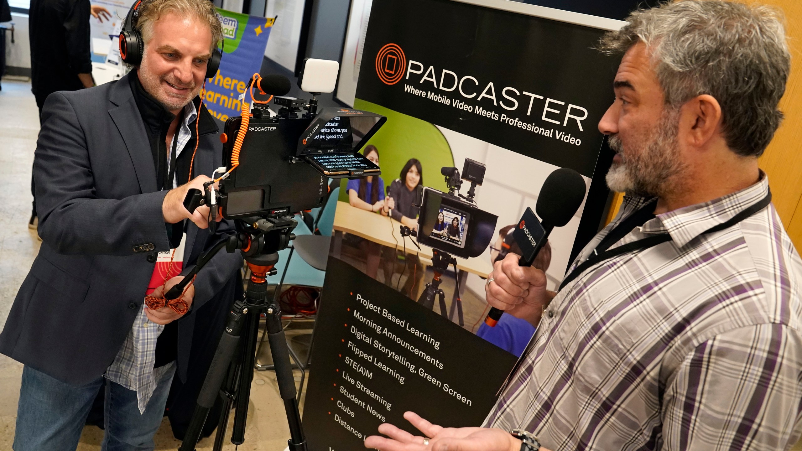 PADCASTER President Jon Goldberg, left, and CEO Josh Apter, demonstrate their Padcaster Studio for remote and virtual learning, at EDTECHWEEK 2023, in New York, Tuesday, Oct. 3, 2023. As soon as the federal pandemic relief started arriving at America's schools, tech companies by the dozens wanted a chance to prove that their software or equipment was exactly what schools needed. (AP Photo/Richard Drew)