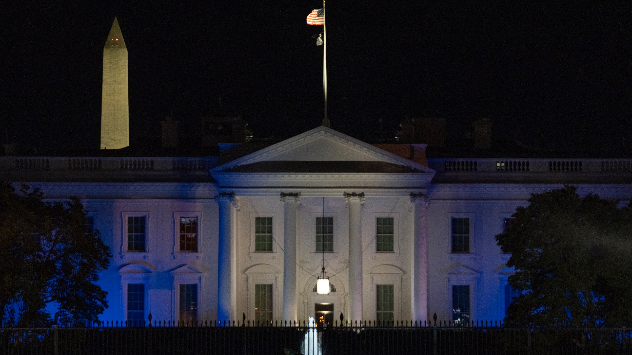 The White House is lit in blue and white, the colors of the Israeli flag, to underscore U.S. solidarity with Israel, Monday, Oct. 9, 2023, in Washington. (AP Photo/Jon Elswick)