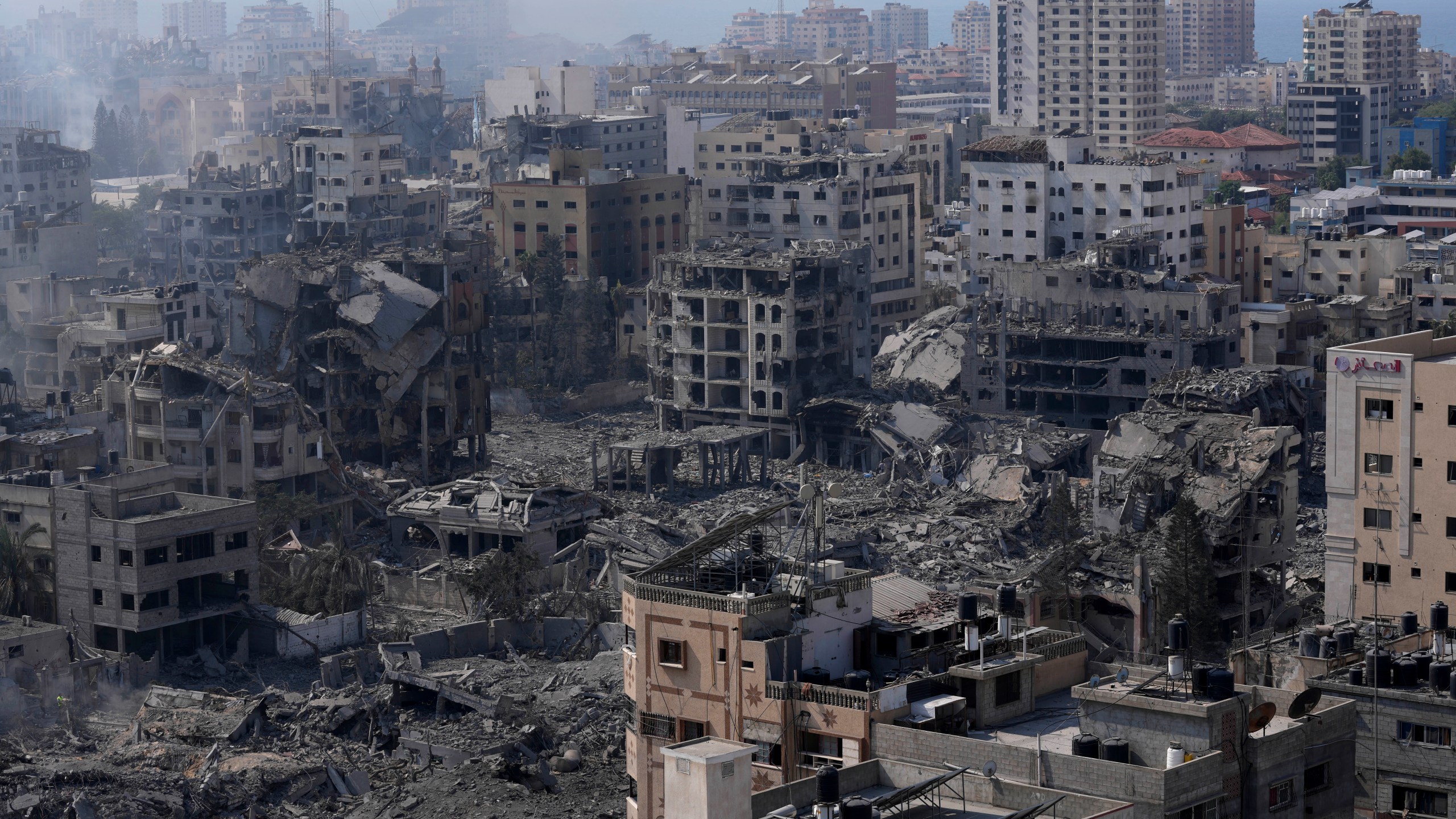 Destruction from Israeli aerial bombardment is seen in Gaza City, Wednesday, Oct. 11, 2023. (AP Photo/Adel Hana)