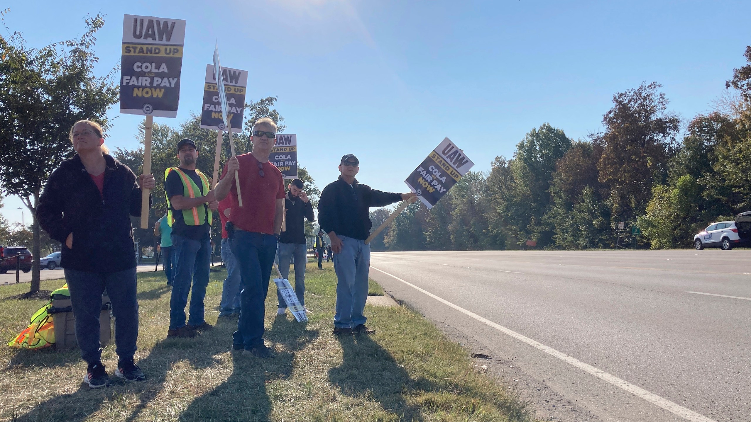 A group of striking union workers picket near an entrance to Ford's Kentucky Truck Plant in Louisville, Ky., Thursday, Oct. 11, 2023. About 8,700 workers went on strike at the massive plant Wednesday night, joining other auto workers around the country who have been on picket lines for weeks. (AP Photo/Dylan Lovan)