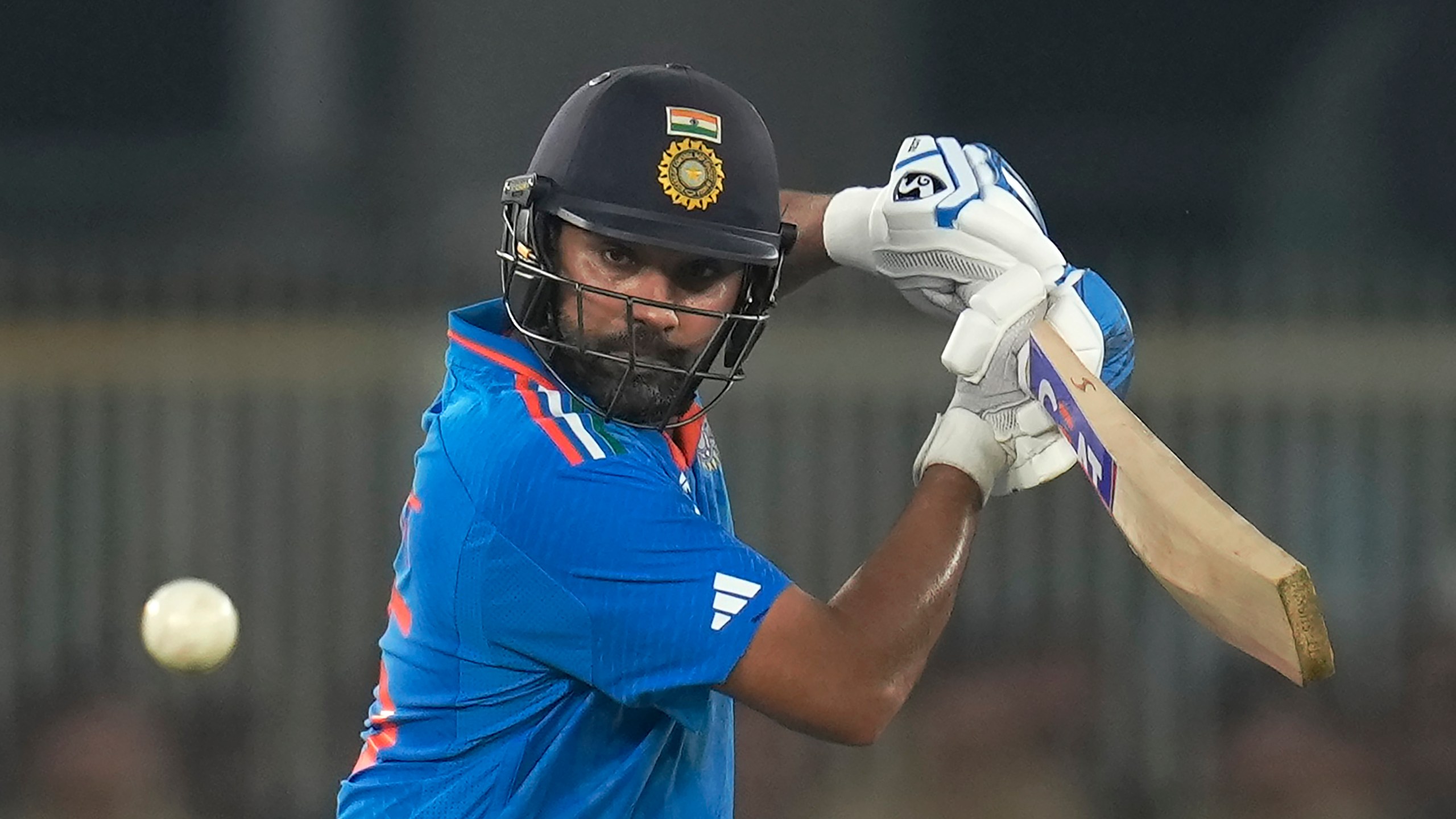 India's captain Rohit Sharma plays a shot during the ICC Men's Cricket World Cup match between India and Pakistan in Ahmedabad, India, Saturday, Oct. 14, 2023.(AP Photo/Rajanish Kakade)