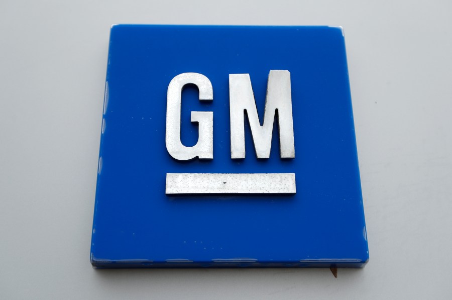 FILE - The General Motors logo is seen, Jan. 27, 2020, in Hamtramck, Mich. On Tuesday, Oct. 17, 2023, General Motors announced that it will delay electric pickup truck production at a factory near Detroit due to slowing U.S. demand for electric vehicles, to better manage its capital investments, and to make some engineering changes. (AP Photo/Paul Sancya, File)