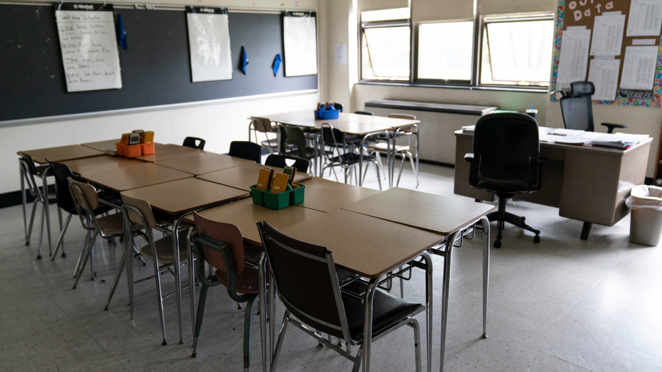 FILE - Desks fill a classroom in a high school in Pennsylvania on Wednesday, May 3, 2023. Gaps between how minority students perform academically in comparison to their white peers have long been an issue across the country. The disparities often stem from larger structural issues — a lack of access to quality curricula, for instance, or teachers expecting students to perform poorly. (AP Photo/Matt Rourke, File)