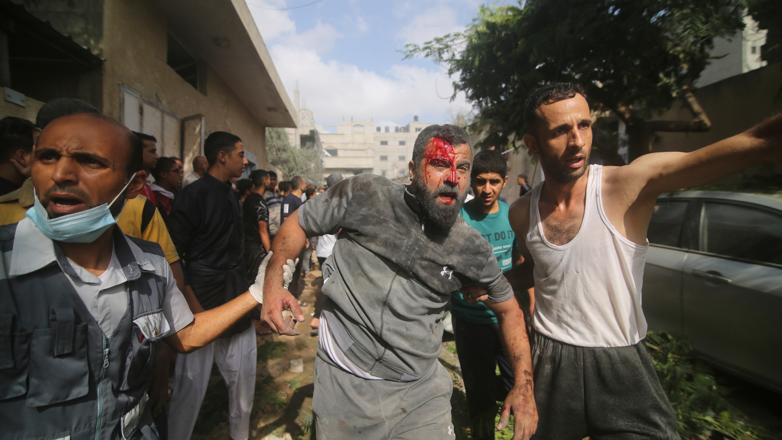 Palestinians are evacuated from buildings hit in the Israeli bombardment of the Gaza Strip in Rafah, Sunday, Oct. 22, 2023. (AP Photo/Hatem Ali)