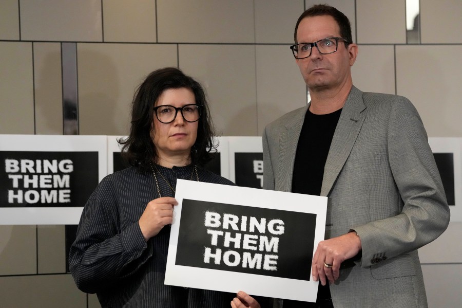 Sharon Lifschitz, left, and Noam Sagi pose for photographers after a press conference of British children of Israeli hostages at a hotel in London, Thursday, Oct. 12, 2023. Noam Sagi, 53, is a London-based psychotherapist who grew up on Kibbutz Nir Oz. His 75-year-old mother, Ada Sagi, was taken hostage on October 7. Sharon Lifschitz, 52, is an artist and academic whose parents are peace activists aged 85 and 83 and were taken hostage too.(AP Photo/Kirsty Wigglesworth)