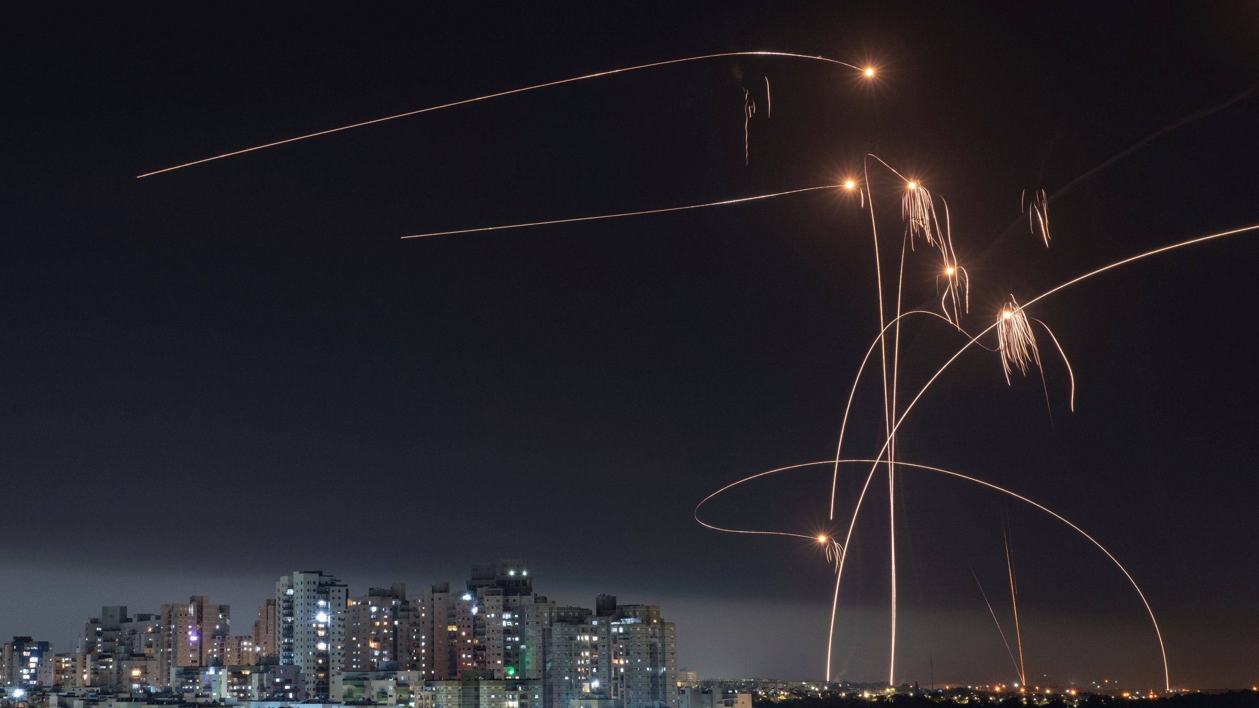 FILE - Israel's Iron Dome missile defense system fires interceptors at rockets launched from the Gaza Strip, in Ashkelon, southern Israel. Thursday, May 11, 2023. Since Israel activated the Iron Dome in 2011, the cutting-edge rocket-defense system has intercepted thousands of rockets fired from the Gaza Strip. By Israeli military estimates, Hamas has already fired 7,000 rockets into Israel during the current war. (AP Photo/Tsafrir Abayov, File)