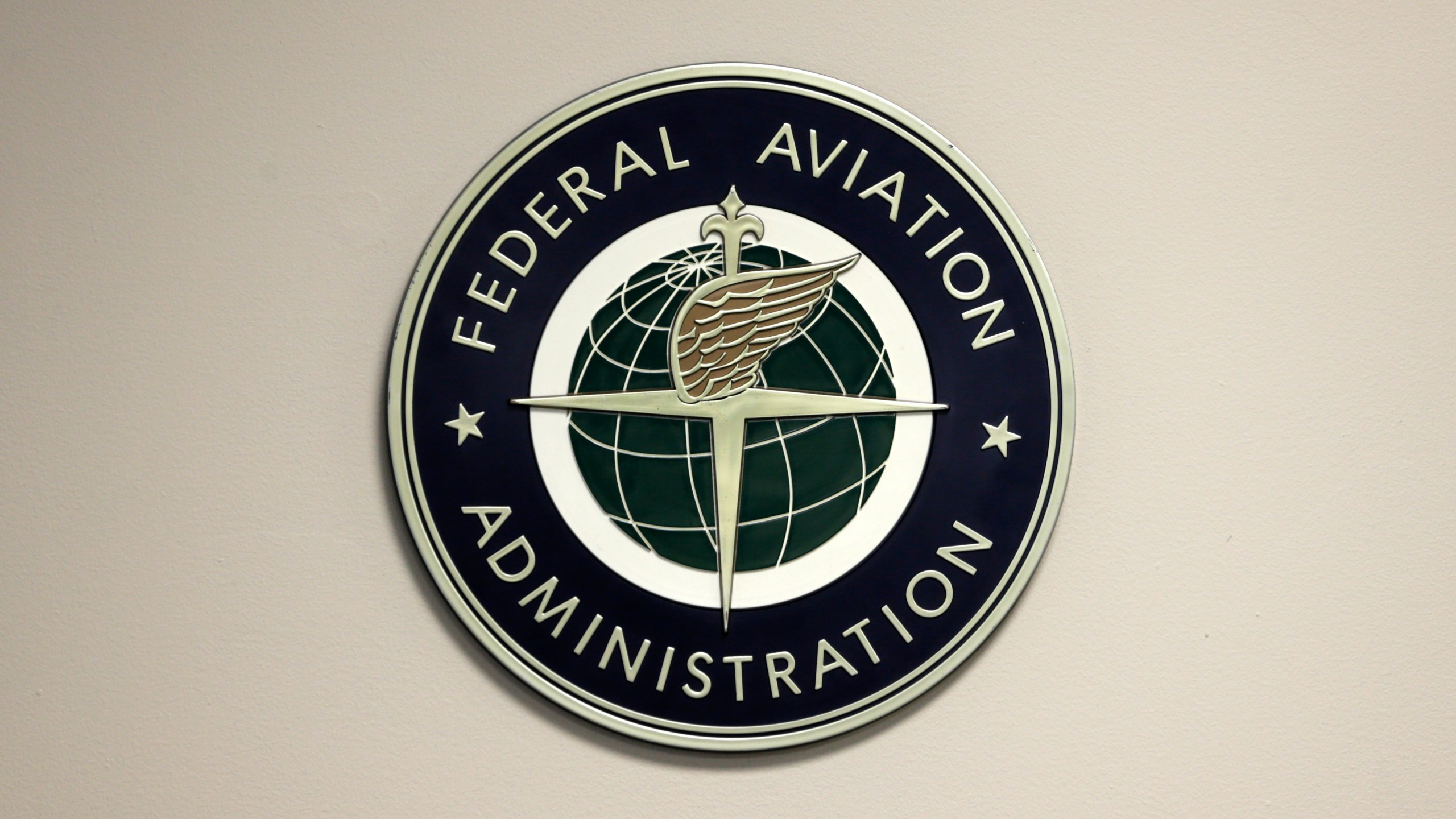 FILE - A Federal Aviation Administration sign hangs in the tower at John F. Kennedy International Airport, March 16, 2017, in New York. The Senate voted 98-0 to approve Michael Whitaker, President Joe Biden’s nominee to lead the Federal Aviation Administration, Tuesday, Oct. 24, 2023, ending a span of nearly 19 months in which the agency was without a Senate-confirmed chief. (AP Photo/Seth Wenig, File)