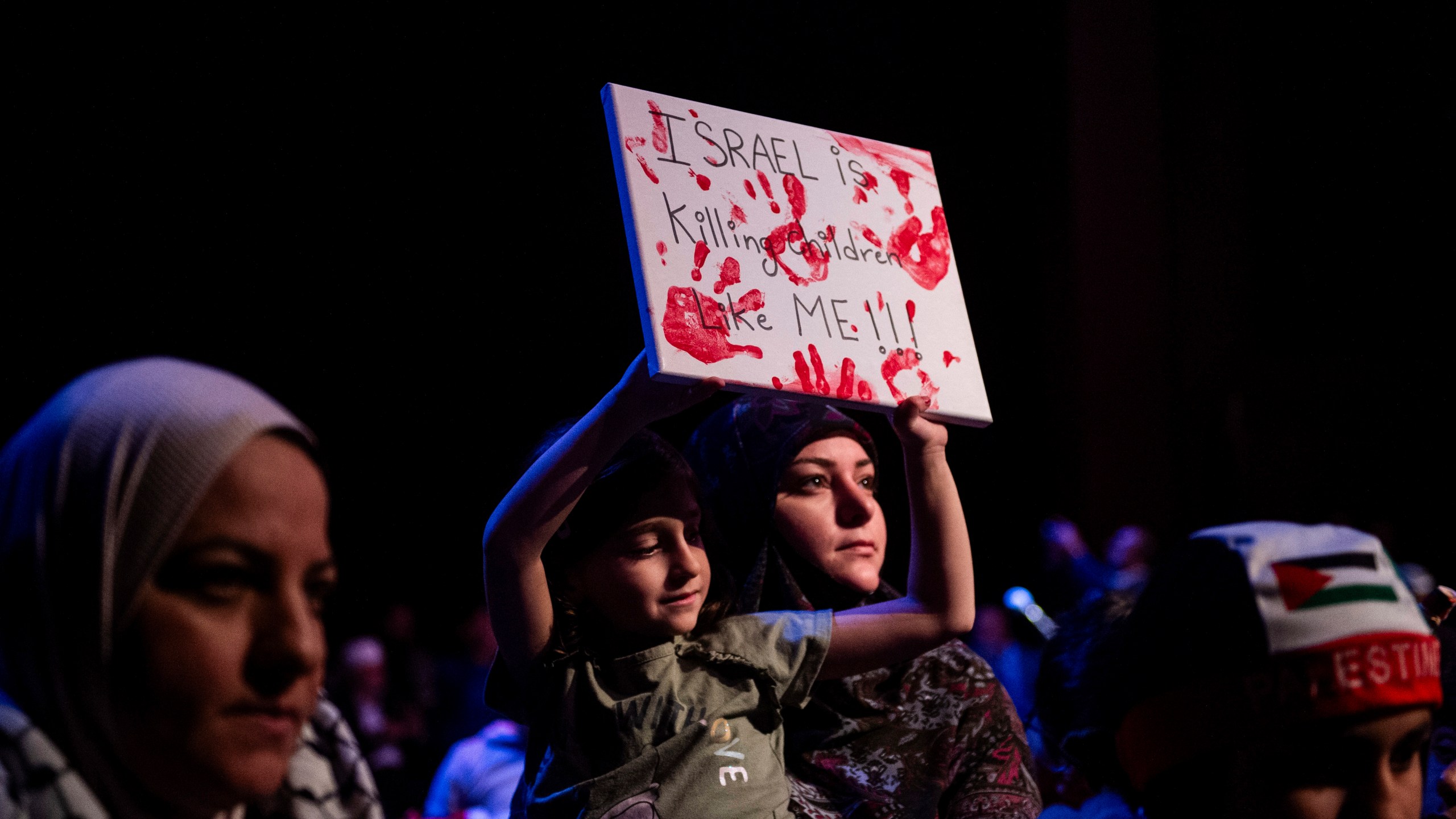 A woman and child attend a rally in support of Palestine in Dearborn, Detroit on Oct. 10, 2023. Many top Michigan Democrats, including Gov. Gretchen Whitmer, took part in a huge pro-Israel rally near Detroit after the Hamas Oct. 7 attack on the country. None of them attended a rally in nearby Dearborn the next day to show support for Palestinians in Gaza being killed or forced from their homes by the Israeli military’s response. The war has inflamed tensions between Jews and Muslims everywhere, including the Detroit area, which is home to several heavily Jewish suburbs and Dearborn, the city with the largest concentration of Arab Americans in the U.S. (Matthew Hatcher/Detroit News via AP)