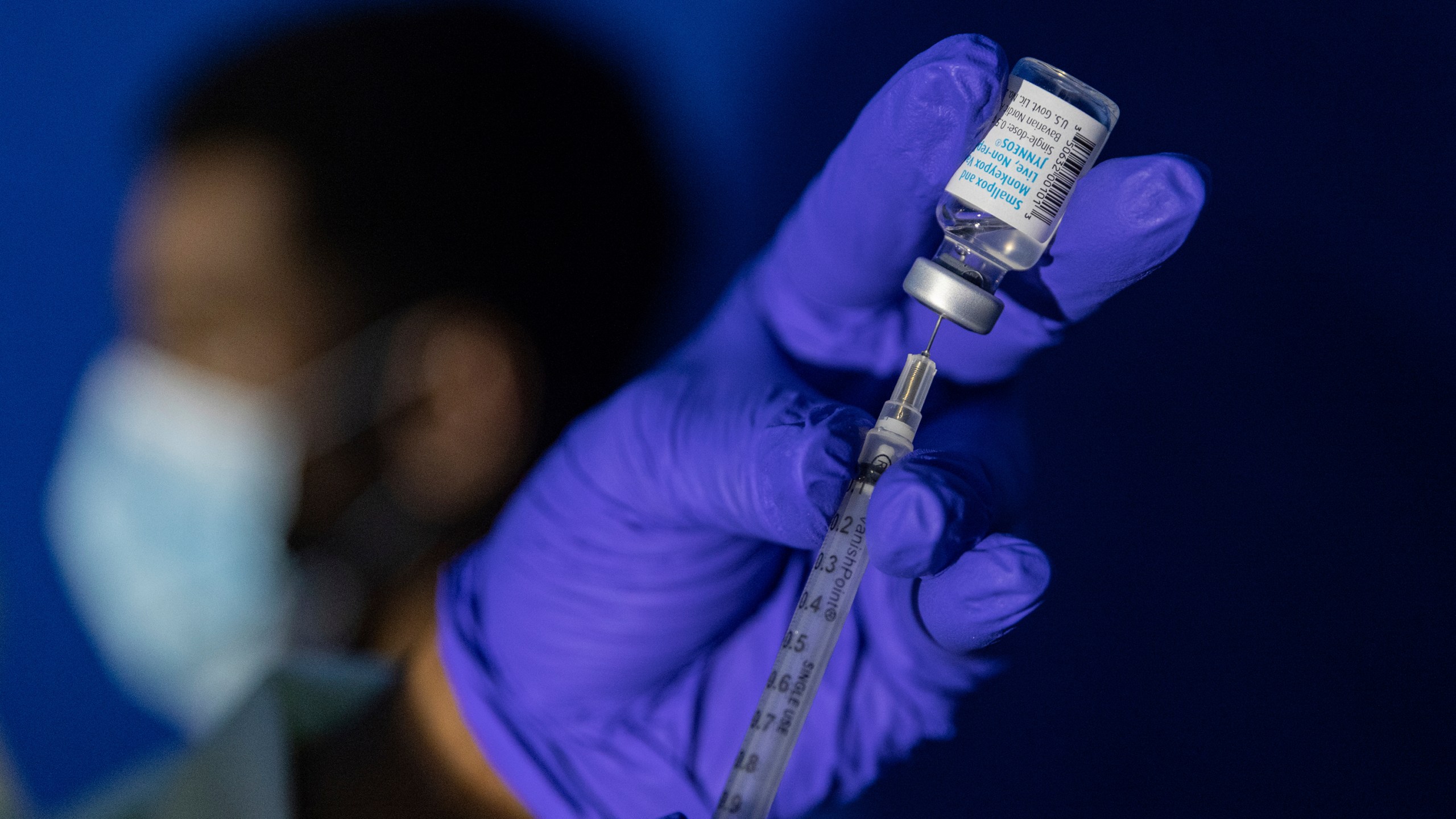 FILE - A family nurse practitioner prepares a syringe with the Mpox vaccine for inoculating a patient at a vaccination site in the Brooklyn borough of New York, on Tuesday, Aug. 30, 2022. Gay and bisexual men at high risk for mpox infection should get vaccinated for the virus even after the current outbreak ends, government health advisers said Wednesday, Oct. 25, 2023. (AP Photo/Jeenah Moon, File)