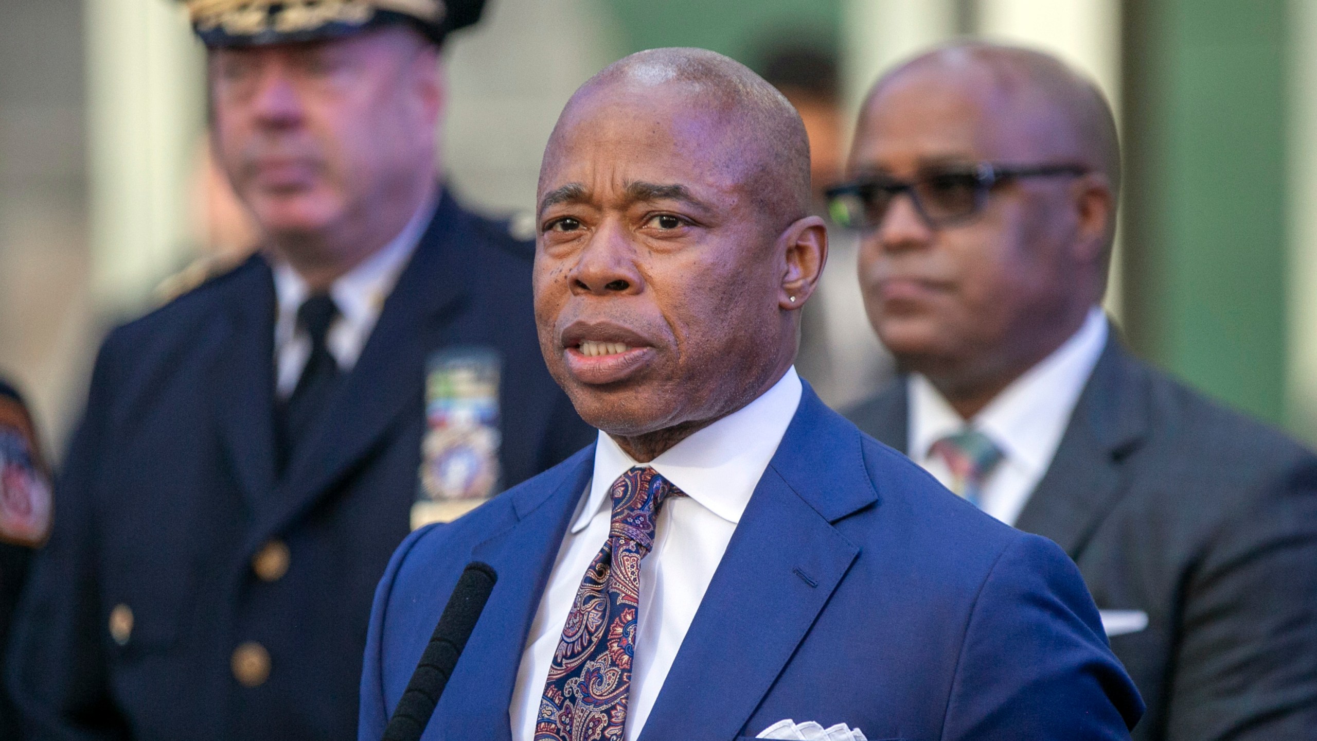 FILE - New York City Mayor Eric Adams speaks in New York's Times Square during a news conference on Dec. 30, 2022. New York City is intensifying efforts to transport migrants out of the city as its shelter system reaches capacity, setting up a dedicated office to provide asylum seekers with free, one-way tickets to anywhere in the world. City Hall confirmed the establishment of a new “reticketing center” in Manhattan as its latest bid to ease pressure on its shelters and finances following the arrival of more than 130,000 asylum seekers since last year. (AP Photo/Ted Shaffrey, File)