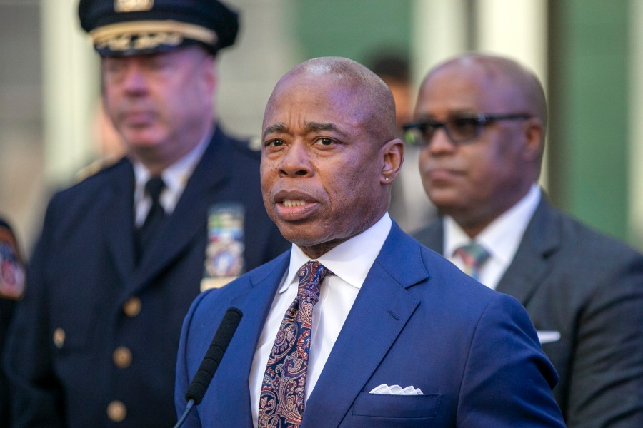 FILE - New York City Mayor Eric Adams speaks in New York's Times Square during a news conference on Dec. 30, 2022. New York City is intensifying efforts to transport migrants out of the city as its shelter system reaches capacity, setting up a dedicated office to provide asylum seekers with free, one-way tickets to anywhere in the world. City Hall confirmed the establishment of a new “reticketing center” in Manhattan as its latest bid to ease pressure on its shelters and finances following the arrival of more than 130,000 asylum seekers since last year. (AP Photo/Ted Shaffrey, File)