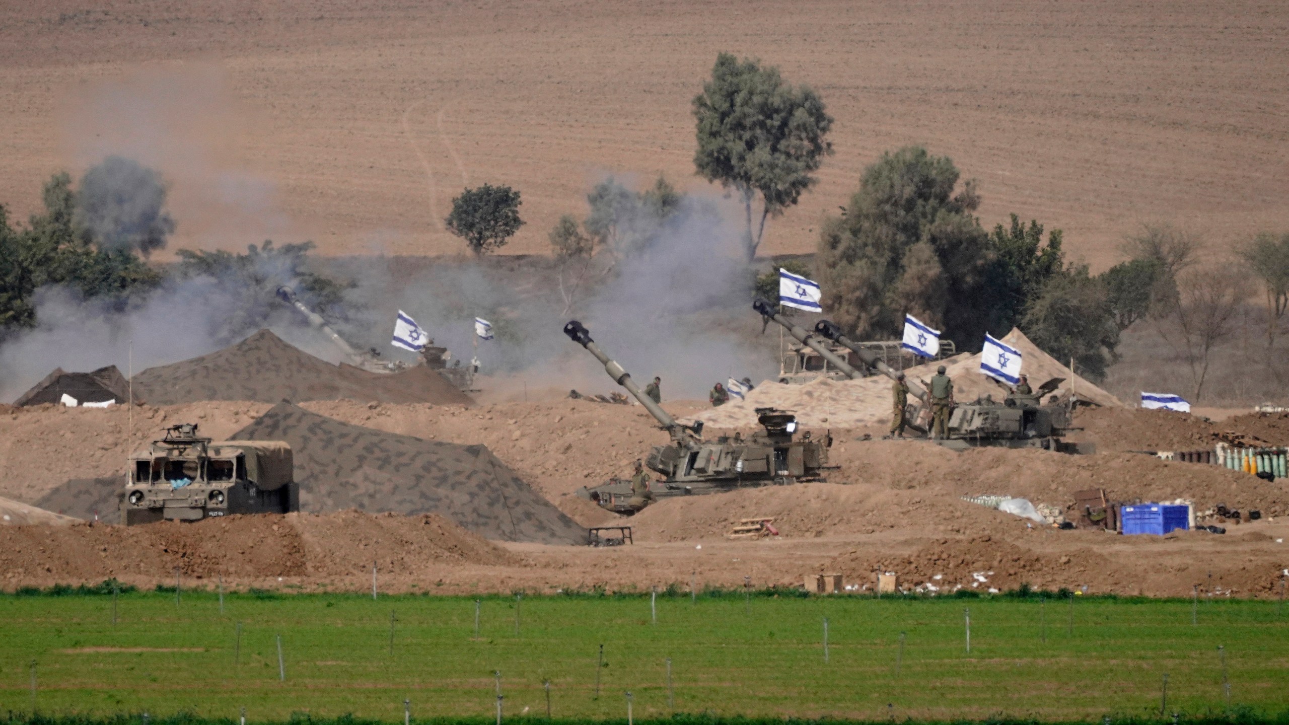 An Israeli mobile artillery unit is seen in a position near the Israel-Gaza border, Israel, Saturday, Oct. 28, 2023. Israel on Saturday expanded its ground operation in Gaza with infantry and armored vehicles backed by "massive" strikes from the air and sea, including the bombing of Hamas tunnels, a key target in its campaign to crush the territory's ruling group after its bloody incursion in Israel three weeks ago. (AP Photo/Tsafrir Abayov)