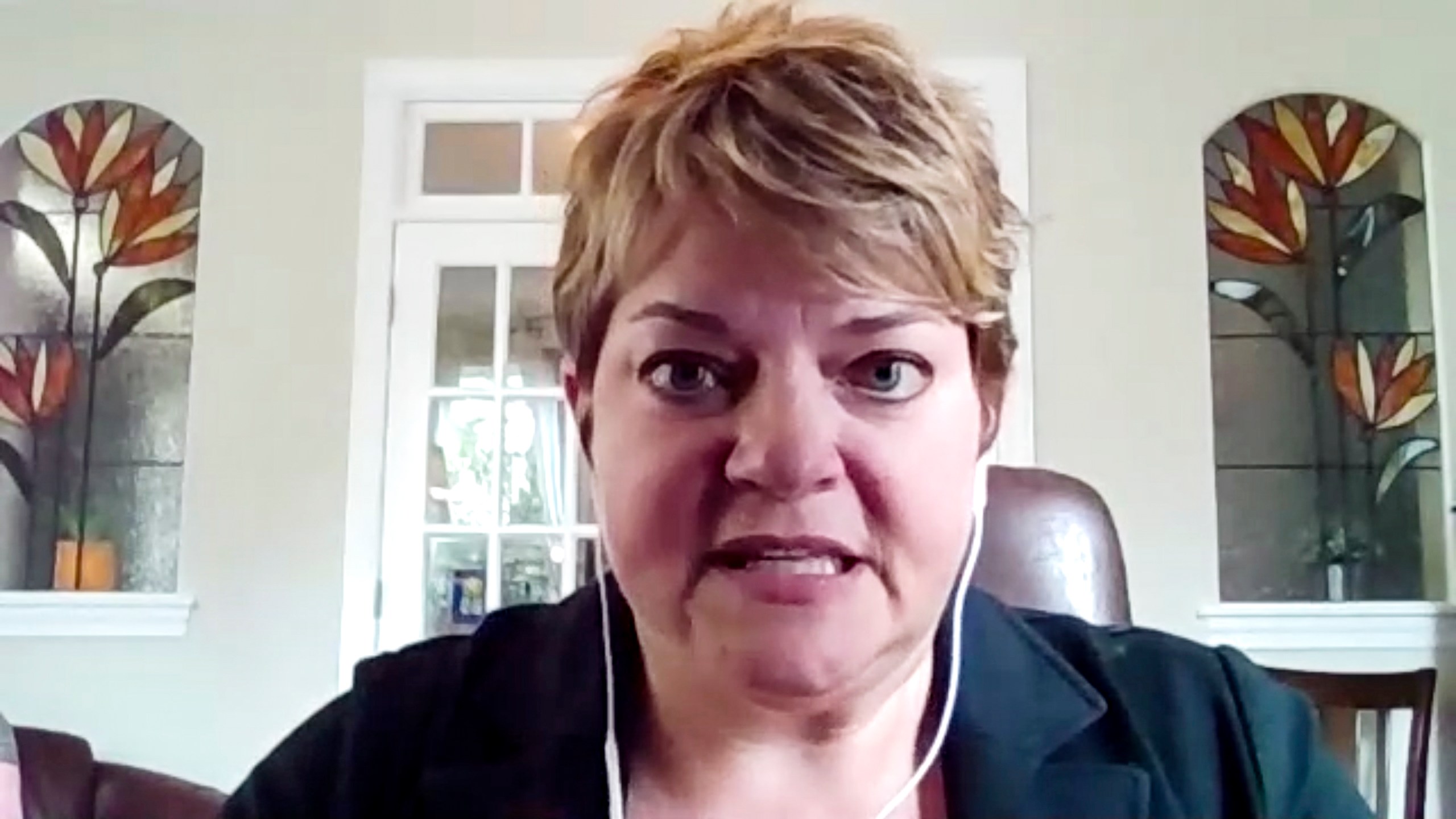 In this image made from video, Michelle Fiscus speaks to the Associated Press, from Franklin, Tenn., on July 13, 2021. The state of Tennessee has agreed to pay $150,000 to settle a federal lawsuit by the former vaccine leader over her firing during the COVID-19 pandemic. The agreement in the case brought by Fiscus includes provisions that limit what each of the parties can say about each other, according to a copy provided by the Tennessee Department of Health in response to a public records request. (AP Photo)