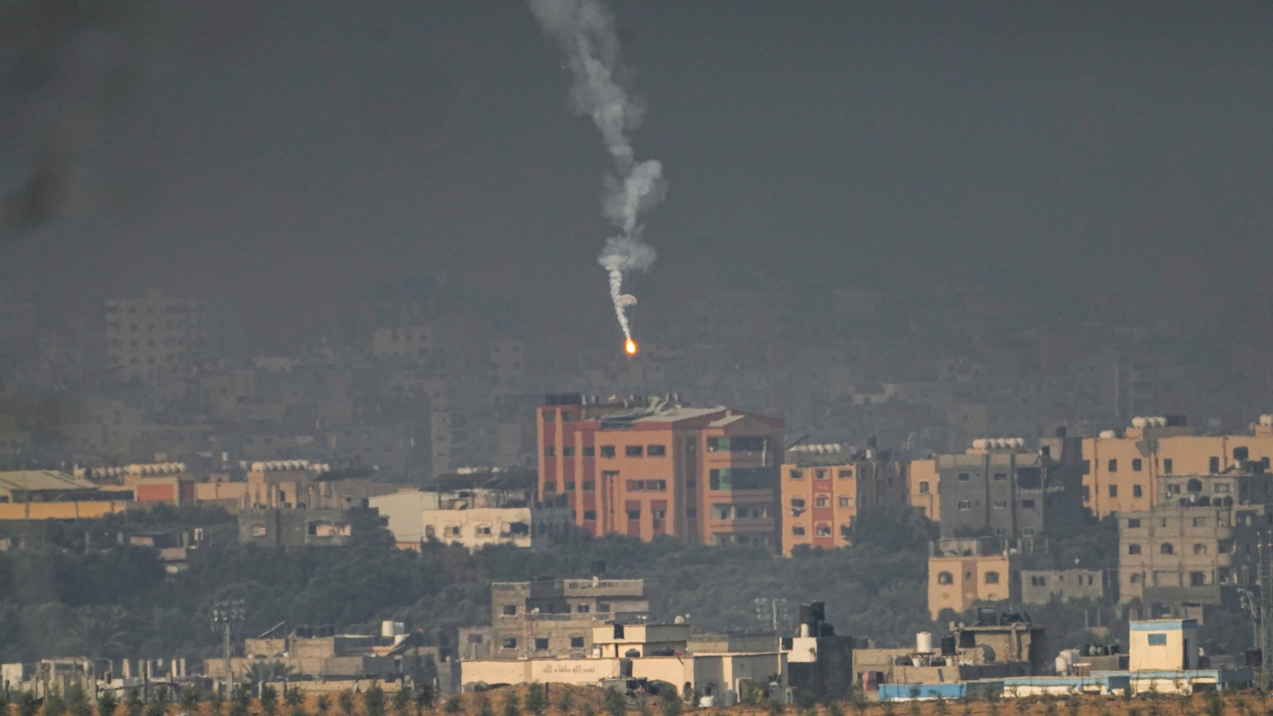 An Israeli army flare is seen over the northern part of the Gaza Strip, as seen from southern Israel, Wednesday, Nov. 1, 2023. (AP Photo/Ariel Schalit)