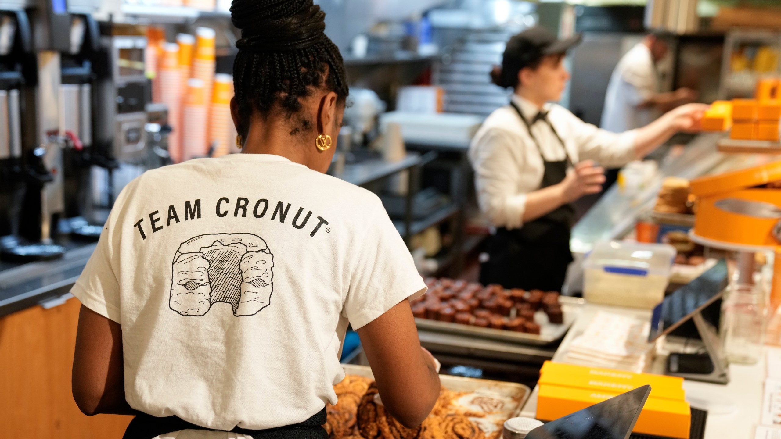 File - Staff members arrange pastries at the Dominique Ansel Bakery in New York, on Sept. 28, 2023. On Friday, the U.S. government issues the October jobs report. (AP Photo/Seth Wenig, File)