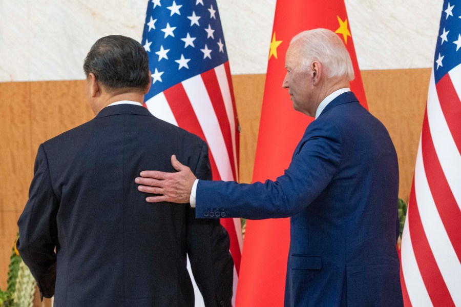 FILE - U.S. President Joe Biden, right, departs with Chinese President Xi Jinping for a meeting on the sidelines of the G20 summit meeting, Nov. 14, 2022, in Bali, Indonesia. (AP Photo/Alex Brandon, File)