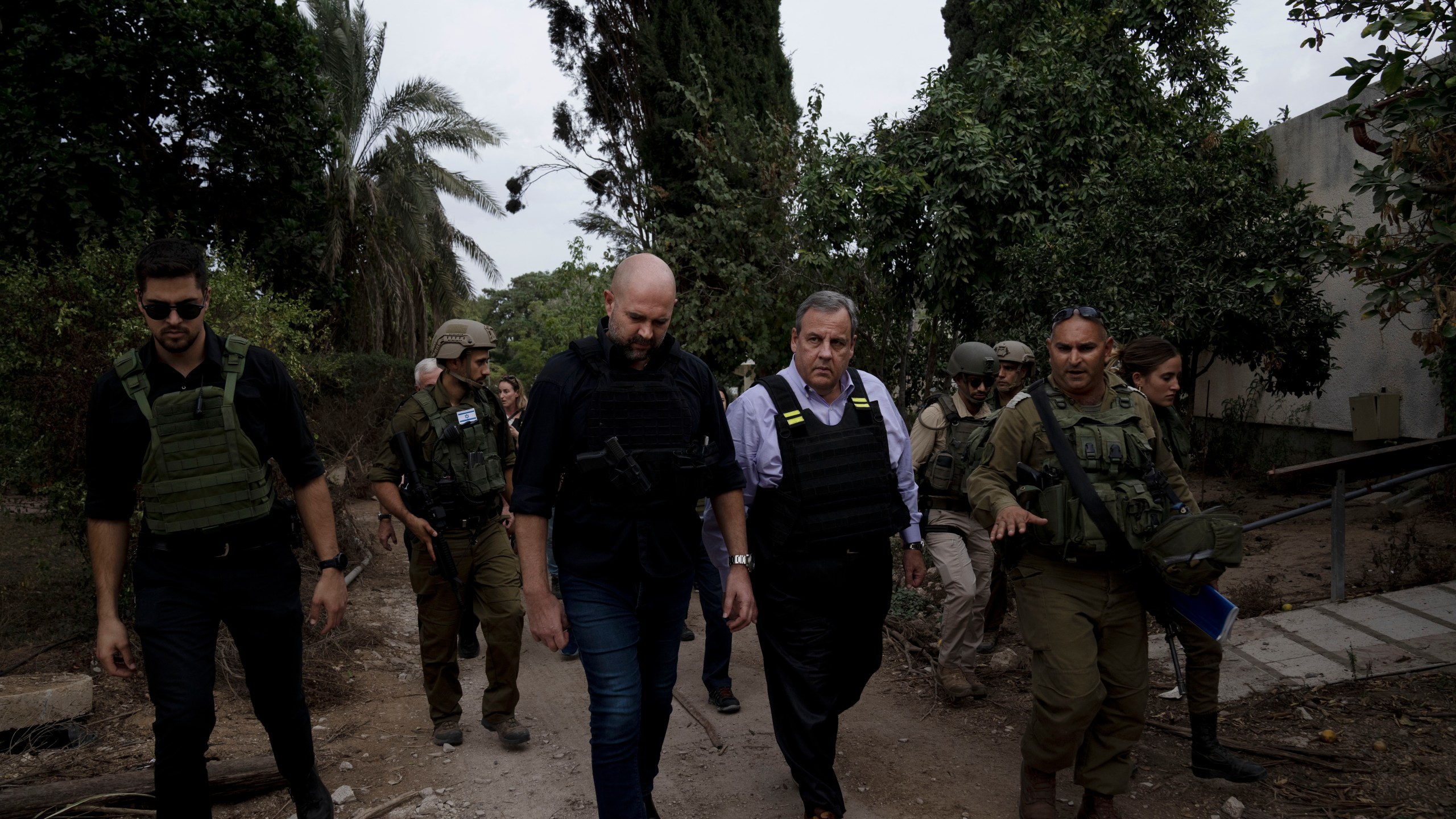 Former New Jersey Governor Chris Christie, front second right, visits Kibbutz Kfar Azza, near the Israel-Gaza border, the site of an Oct. 7 massacre by Hamas, with Israel's Knesset Speaker Amir Ohana, front second left and Israeli Army Maj. Diamond, front right, Sunday, Nov. 12, 2023. (AP Photo/Maya Alleruzzo)