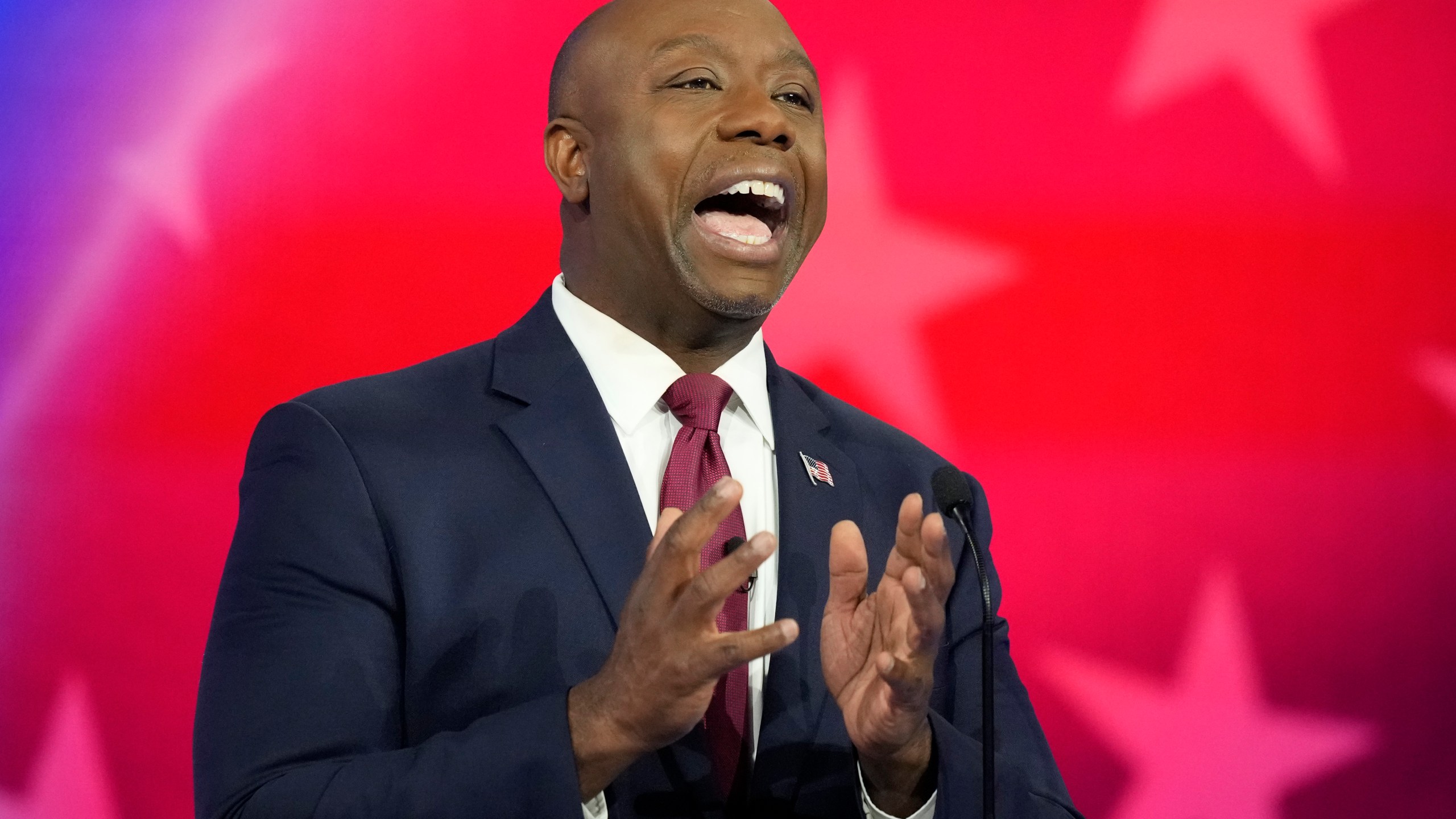 Republican presidential candidate Sen. Tim Scott, R-S.C., speaks during a Republican presidential primary debate hosted by NBC News, Wednesday, Nov. 8, 2023, at the Adrienne Arsht Center for the Performing Arts of Miami-Dade County in Miami. (AP Photo/Rebecca Blackwell)