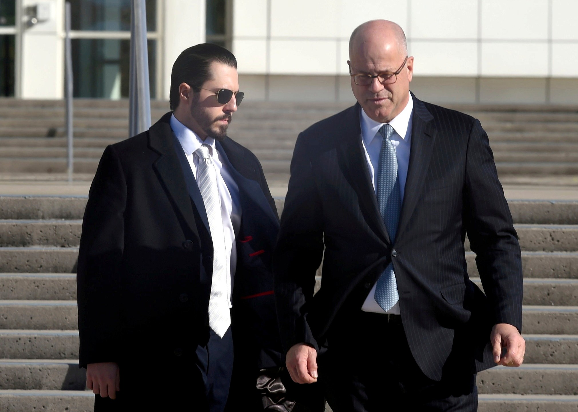 Samuel Miele, left, leaves Federal Court in Central Islip, N.Y., with his lawyer, Kevin Marino, on Tuesday, Nov 14, 2023. Miele, a former fundraiser for U.S. Rep. George Santos, pleaded guilty to a federal wire fraud charge. (John Roca/Newsday via AP)