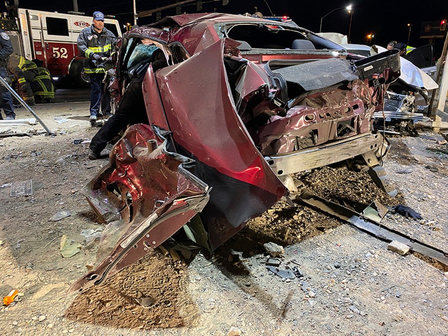 FILE - This photo released by the North Las Vegas Police Department shows a wrecked Dodge Challenger, Jan. 29, 2022, in North Las Vegas. The National Transportation Safety Board wants automakers to install systems on all new vehicles that warn drivers when they go over the speed limit, and it is asking safety regulators to figure out how states can electronically limit speeds on vehicles driven by repeat traffic offenders. NTSB's recommendations to combat excessive speeding came after a hearing Tuesday, Nov. 14, 2023, on the January 2022 crash in North Las Vegas. (North Las Vegas Police Department via AP, File)