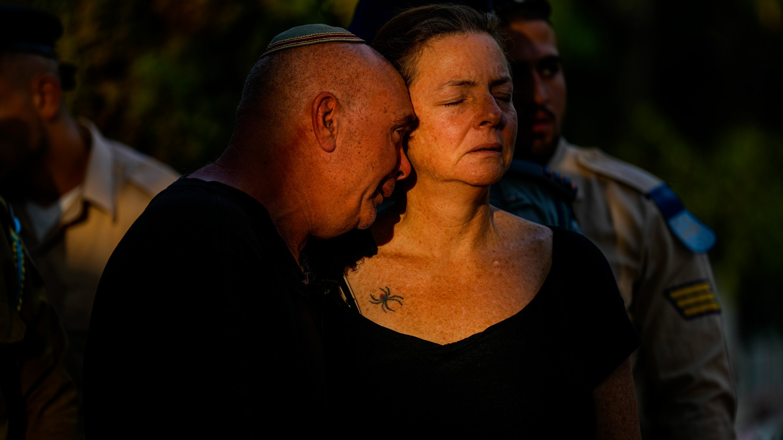 Doron and Tami, parents of Israeli reserve soldier captain Omri Yosef David mourn during his funeral in Carmiel, northern Israel, Wednesday, Nov. 15, 2023. David, 27, was killed during a military ground operation in the Gaza Strip. (AP Photo/Ariel Schalit)