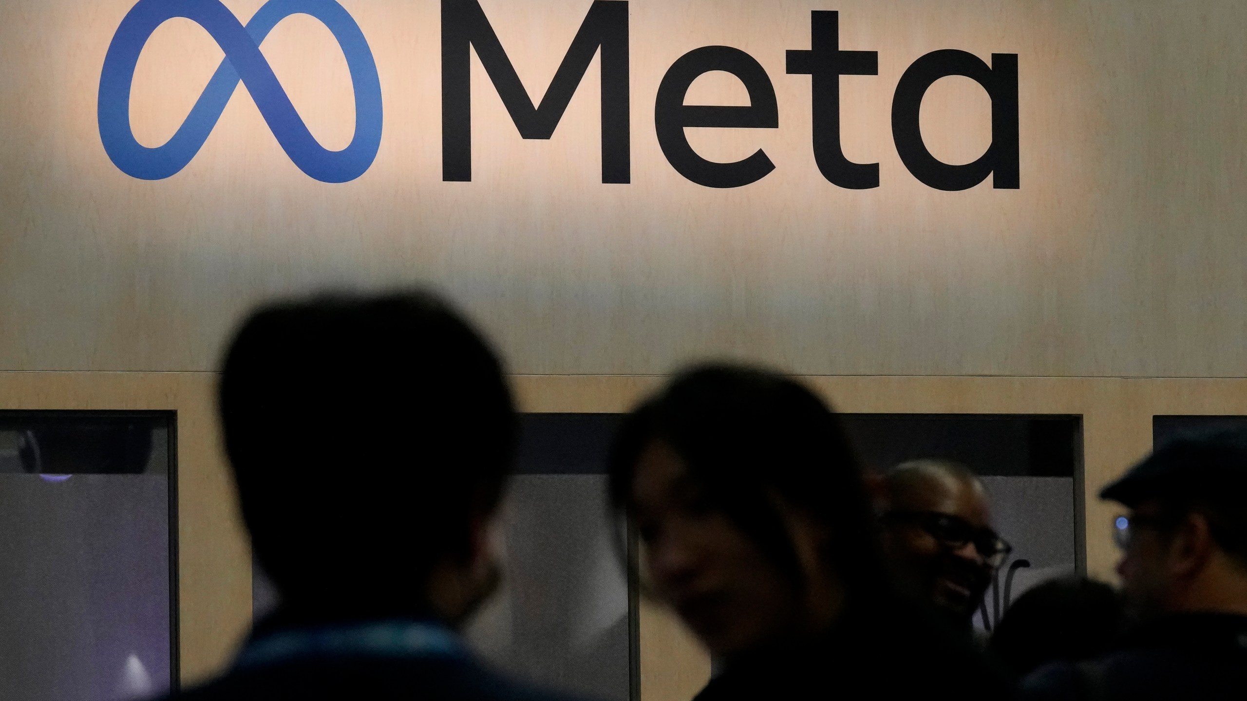 FILE - Attendees visit the Meta booth at the Game Developers Conference 2023 in San Francisco on March 22, 2023. TikTok and Facebook owner Meta are filing legal challenges against new European Union rules designed to counter the dominance of digital giants and make online competition fairer by giving consumers more choice. (AP Photo/Jeff Chiu, File)