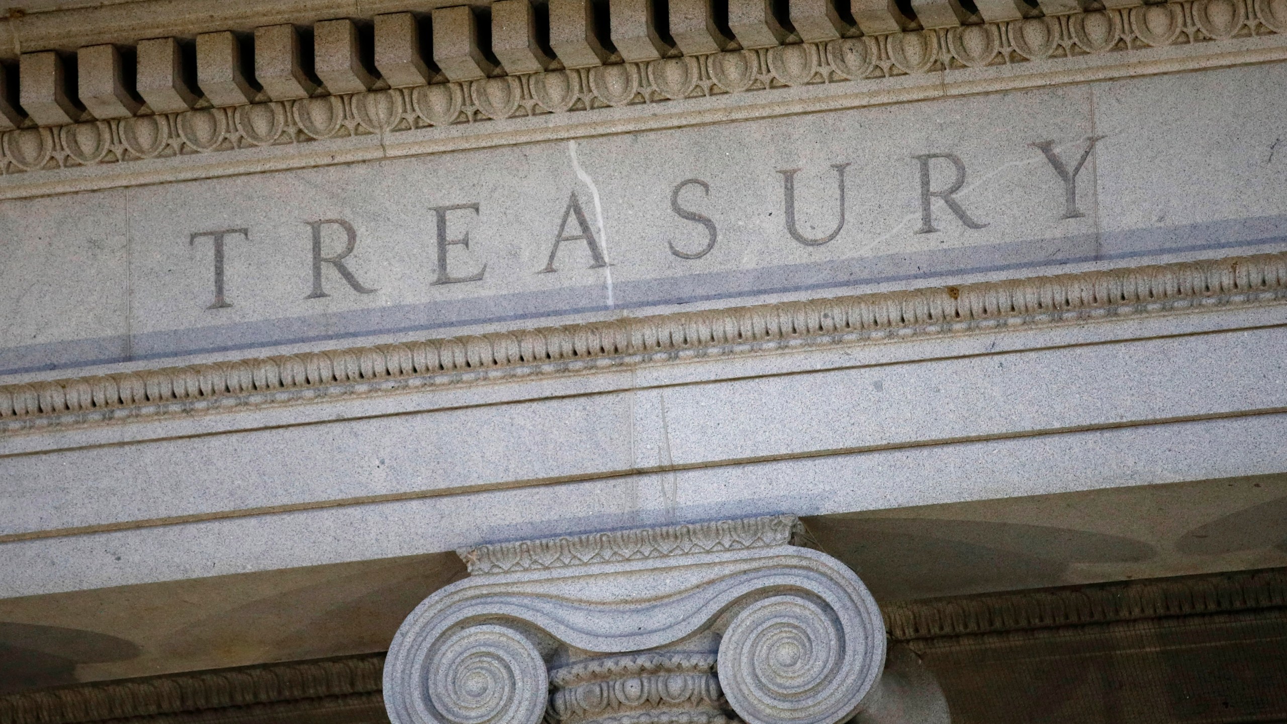 FILE- The U.S. Treasury Department building is shown at dusk in Washington on June 6, 2019. (AP Photo/Patrick Semansky, File)