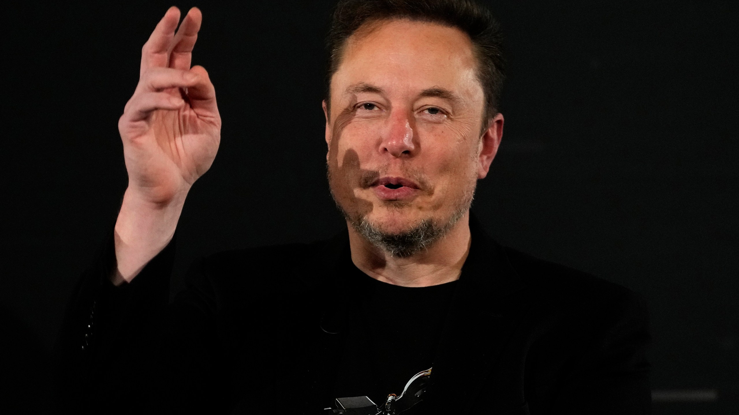 File - Elon Musk, owner of social media platform X, gestures during an event with Britain's Prime Minister Rishi Sunak in London on Nov. 2, 2023. IBM has stopped advertising on X after a report said its ads were appearing alongside material praising Adolf Hitler and Nazis. (AP Photo/Kirsty Wigglesworth, Pool, File)