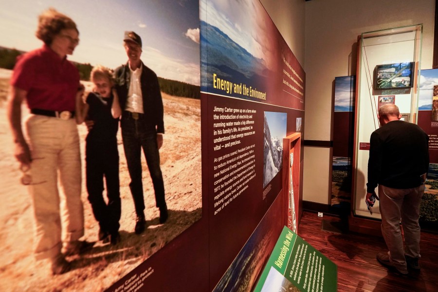 Dennison Doldolato, of Salt Lake City, Utah, looks at a display inside the Jimmy Carter National Historical Park, Monday, Nov. 20, 2023, in Plains, Ga. Rosalynn Carter, the closest adviser to Jimmy Carter during his one term as U.S. president and their four decades thereafter as global humanitarians, died Sunday, Nov. 19, 2023. She was 96. (AP Photo/Mike Stewart)