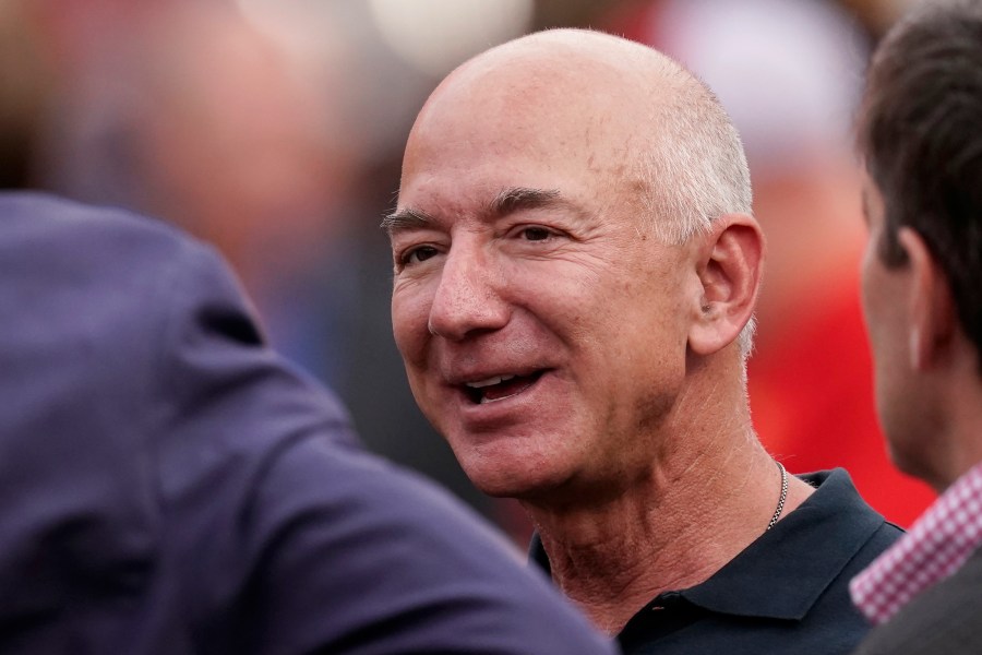 FILE - Amazon founder Jeff Bezos is seen on the sidelines before the start of an NFL football game between the Kansas City Chiefs and the Los Angeles Chargers Thursday, Sept. 15, 2022, in Kansas City, Mo. Bezos’ fund to support homeless families announced $117 million in new grants on Tuesday, Nov. 21, 2023 to organizations across the U.S. and Puerto Rico. The grants are a part of a $2 billion commitment Bezos made in 2018 to support homeless families and to run free preschools. (AP Photo/Charlie Riedel, File)