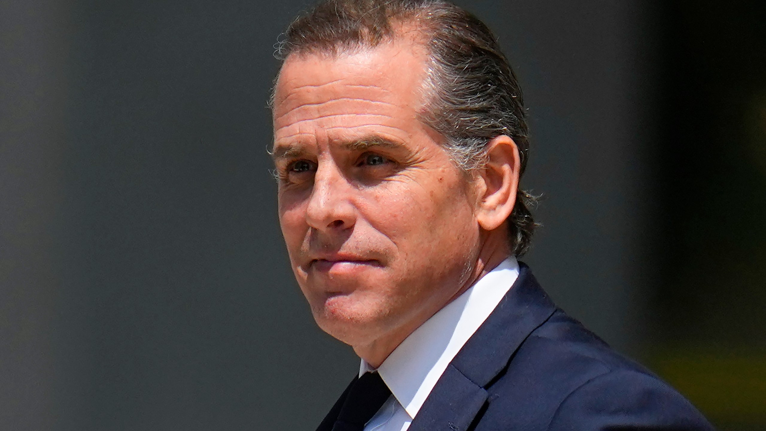 FILE - President Joe Biden's son, Hunter Biden, leaves after a court appearance, July 26, 2023, in Wilmington, Del. Hunter Biden has asked a judge to approve subpoenas for documents from Donald Trump and former Justice Department officials related to whether political pressure wrongly influenced the criminal case against him. Defense attorneys for President Joe Biden’s son say Trump pressured the Justice Department to investigate and prosecute him to bolster the Republican's own political fortunes. (AP Photo/Julio Cortez, File)