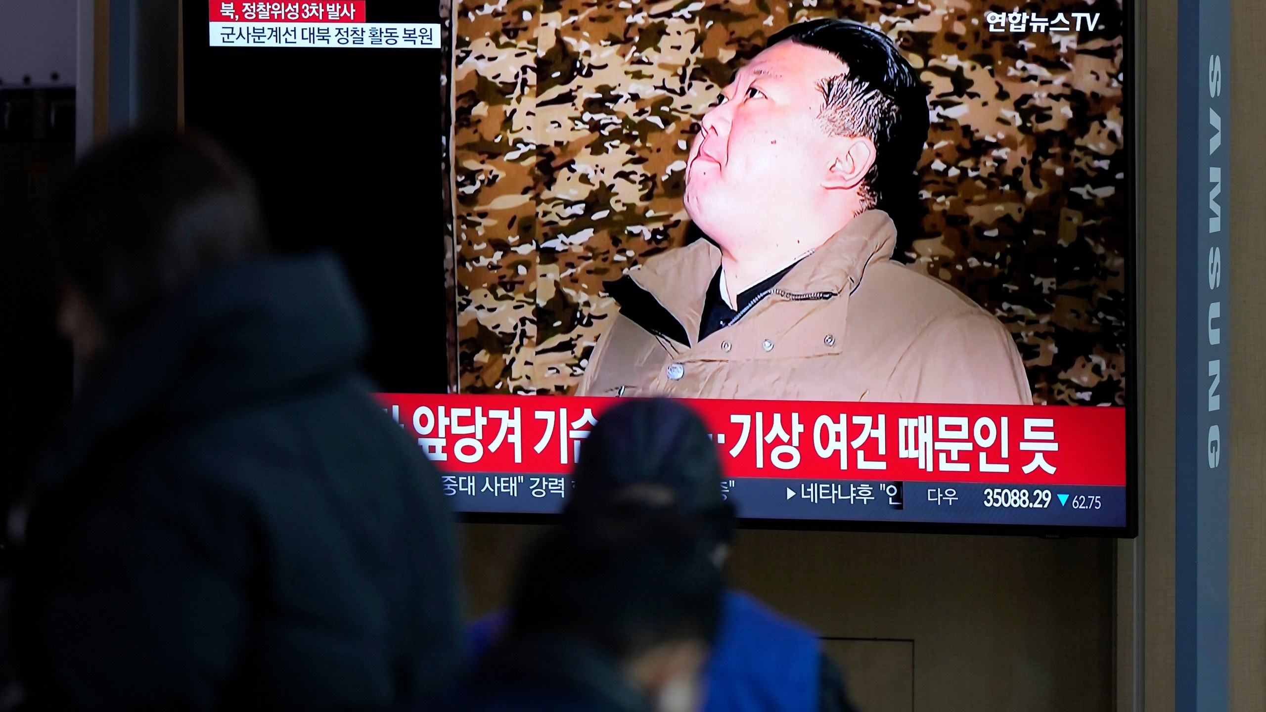 A TV screen shows a report on North Korea's spy satellite into orbit with its third launch attempt this year with an image of North Korea's leader Kim Jong Un during a news program at the Seoul Railway Station in Seoul, South Korea, Wednesday, Nov. 22, 2023. North Korea claimed Wednesday to have successfully placed a spy satellite into orbit with its third launch attempt this year, demonstrating the nation's determination to build a space-based surveillance system during protracted tensions with the United States. The letters read "North Korea, third launch of a spy satellite." (AP Photo/Lee Jin-man)