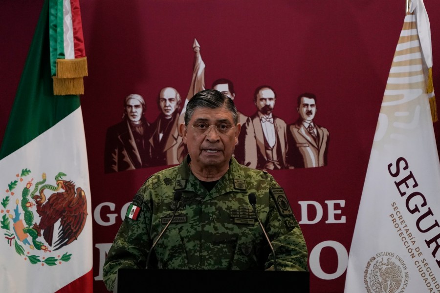 FILE - Mexican Defense Secretary Luis Cresencio Sandoval announces the arrest of Ovidio during a press conference in Mexico City, on Jan. 5, 2023. The U.S. government thanked Mexico for arresting a hyper violent alleged Sinaloa cartel security chief, but according to details released Friday, Nov. 24, 2023 the arrest of suspect Nestor Isidro Pérez Salas this week may have been highly personal for the Mexican army. Sandoval said Pérez Salas had ordered a 2019 attack on an unguarded apartment complex where soldiers’ families lived. (AP Photo/Eduardo Verdugo, File)