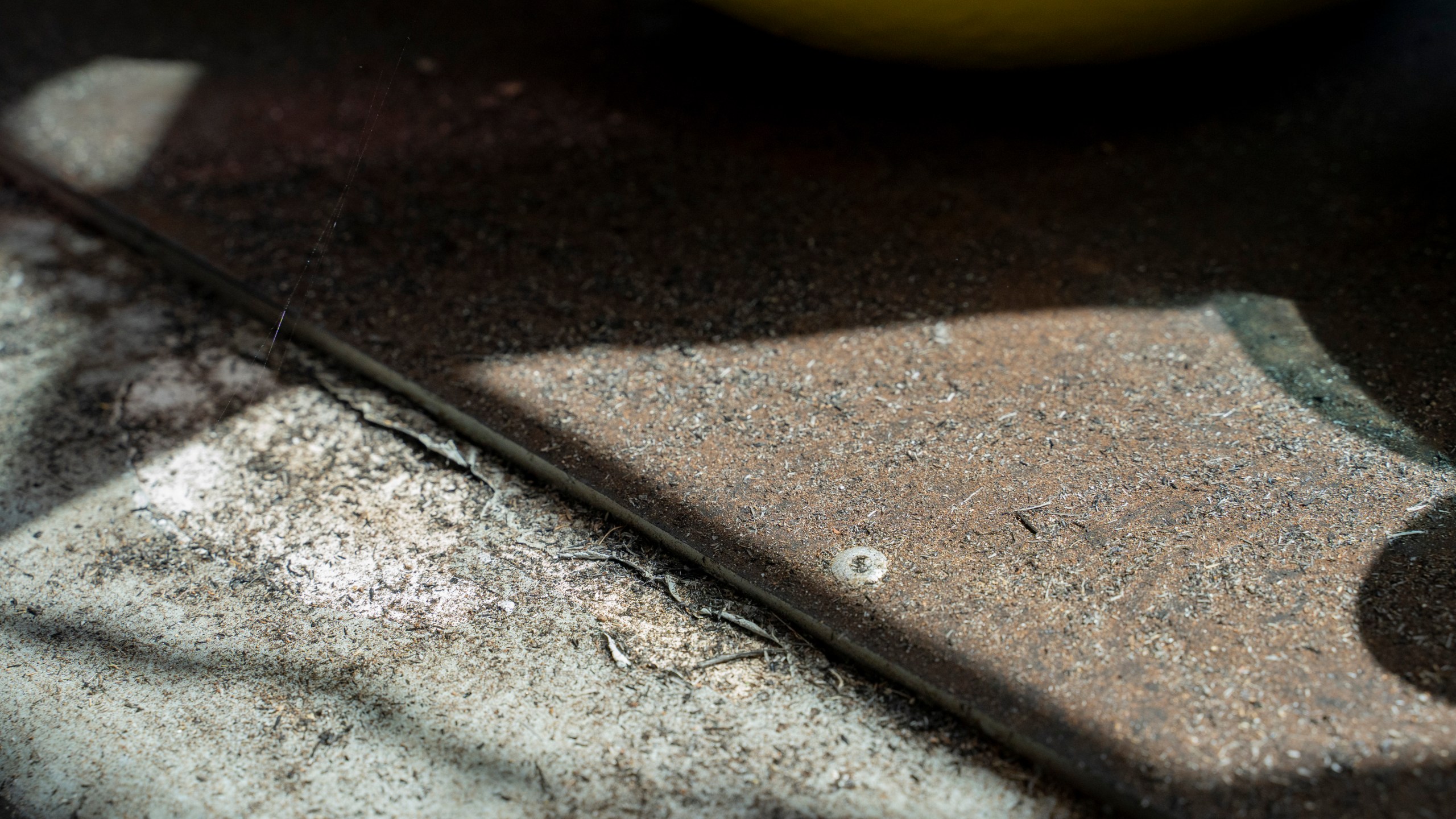 Ash from August's wildfire blankets Daniel Skousen's home on Friday, Nov. 3, 2023, in Lahaina, Hawaii. (AP Photo/Mengshin Lin)