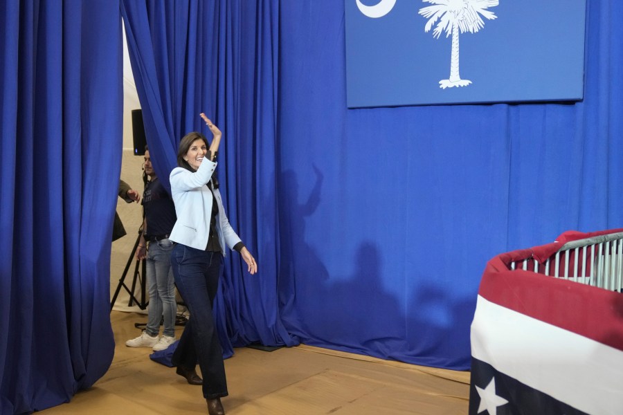 GOP presidential hopeful Nikki Haley waves as she enters a campaign event on Monday, Nov. 27, 2023, in Bluffton, S.C. Haley is among a cluster of Republican candidates competing for second place in a GOP Republican primary thus far largely dominated by former President Donald Trump. (AP Photo/Meg Kinnard)